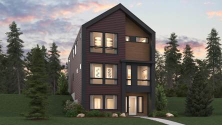 A house with a lawn and trees in the front.