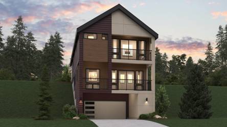 A house with a driveway and trees.