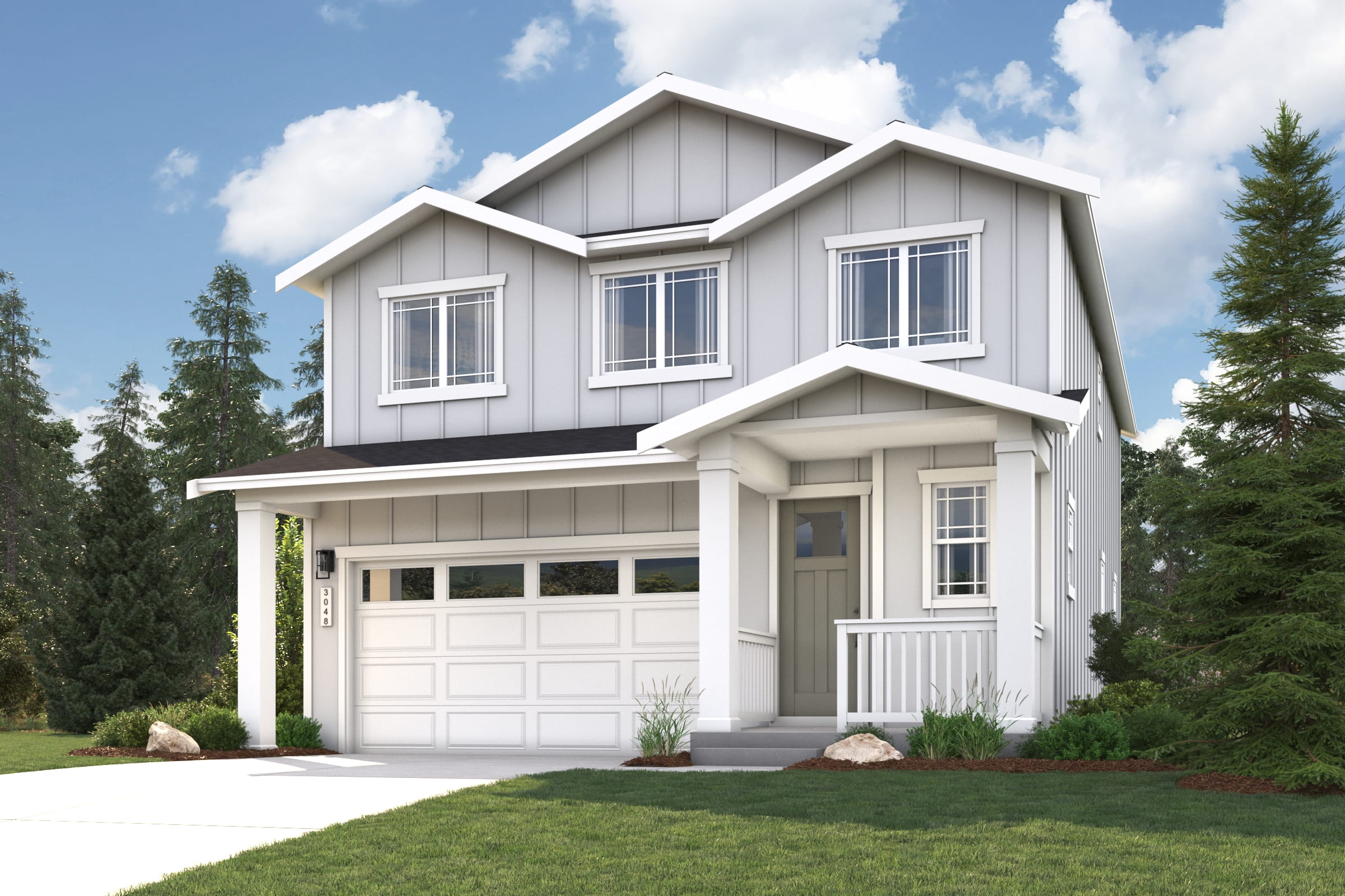 A white house with a garage.