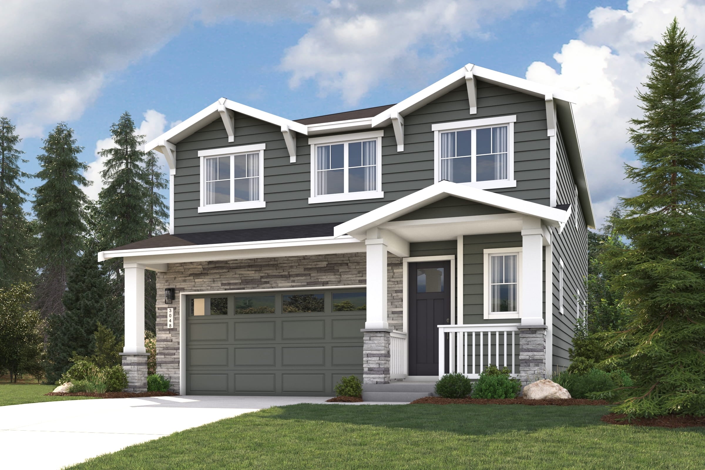 A house with a garage and trees.