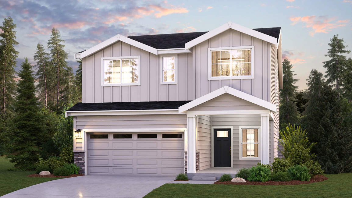 A house with a garage and trees around it.