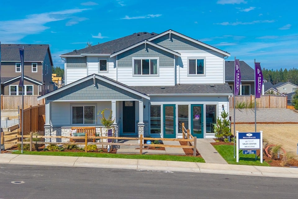 A house with a sign in front.