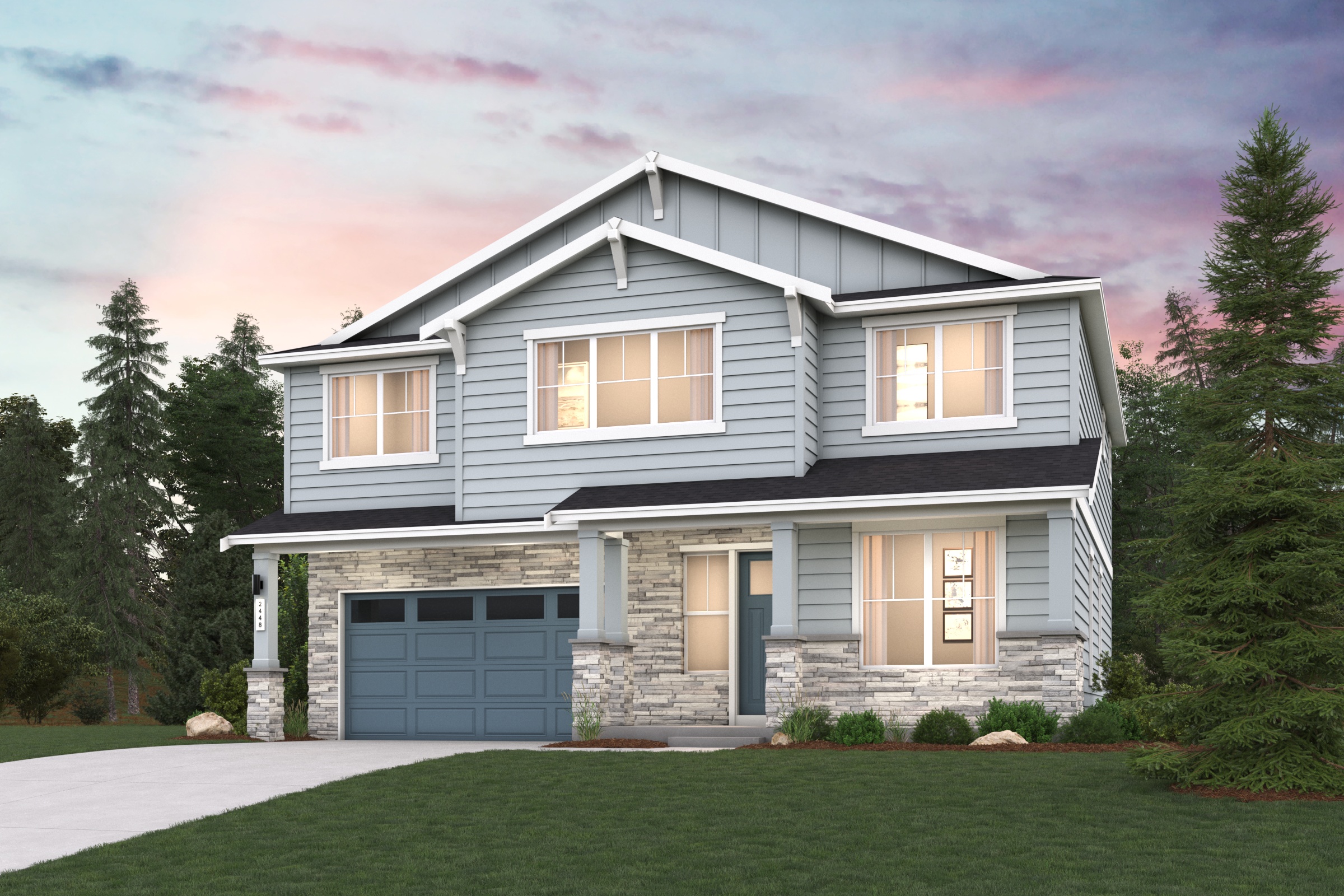 A house with a garage and trees in the back.