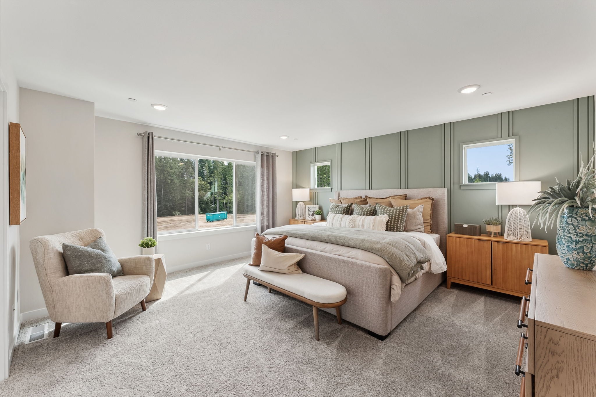 A large living room with a large window.