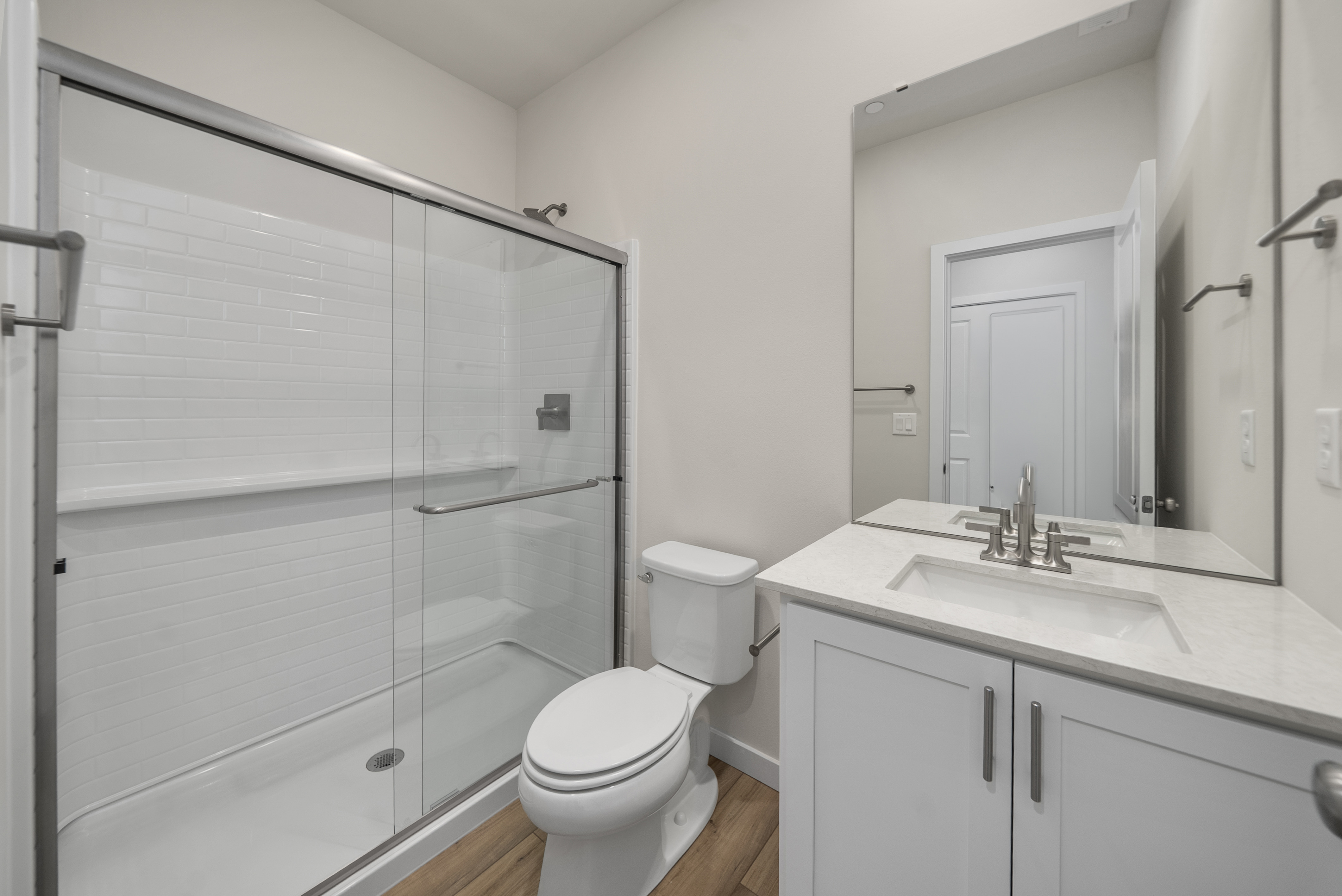 A bathroom with a glass shower.