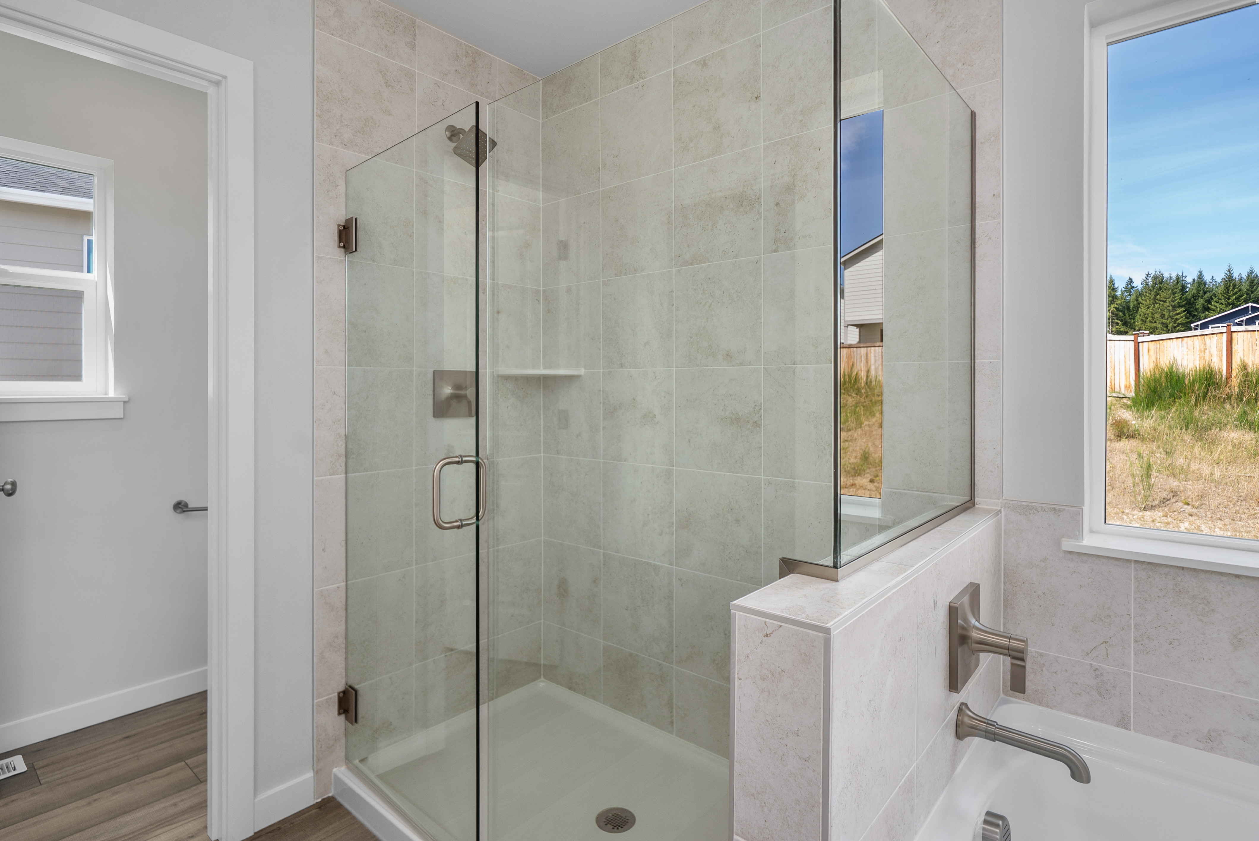 A bathroom with a glass shower.