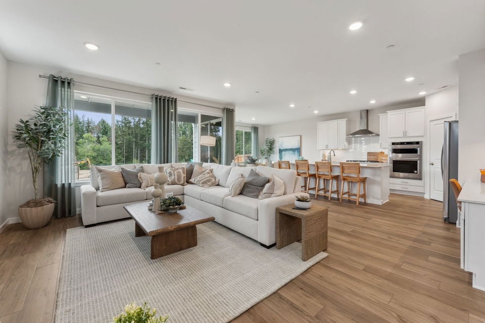 A large living room with a large window.