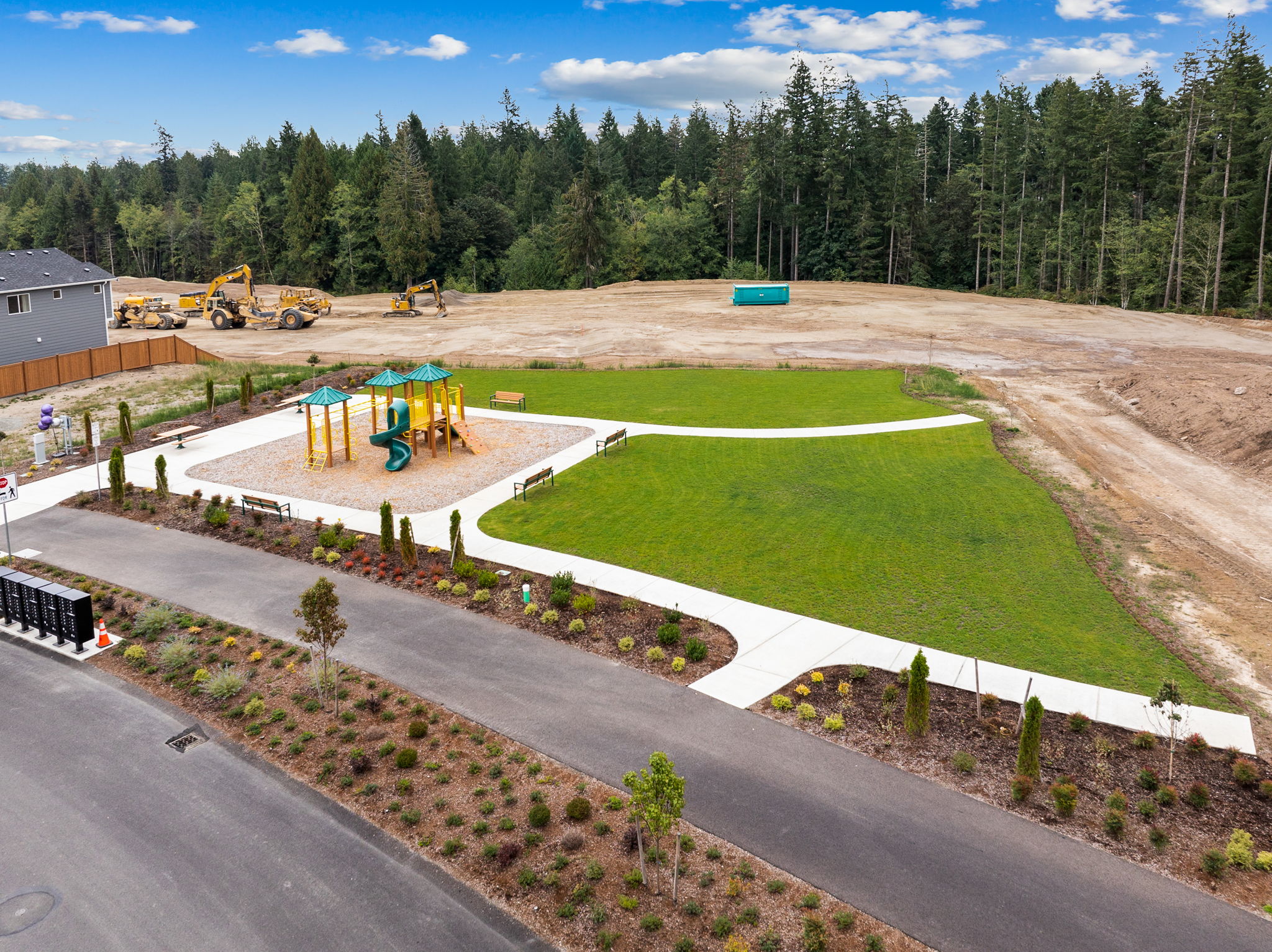 A construction site with trees in the background.