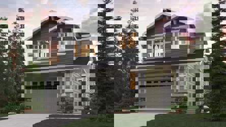 A house with a garage and trees around it.