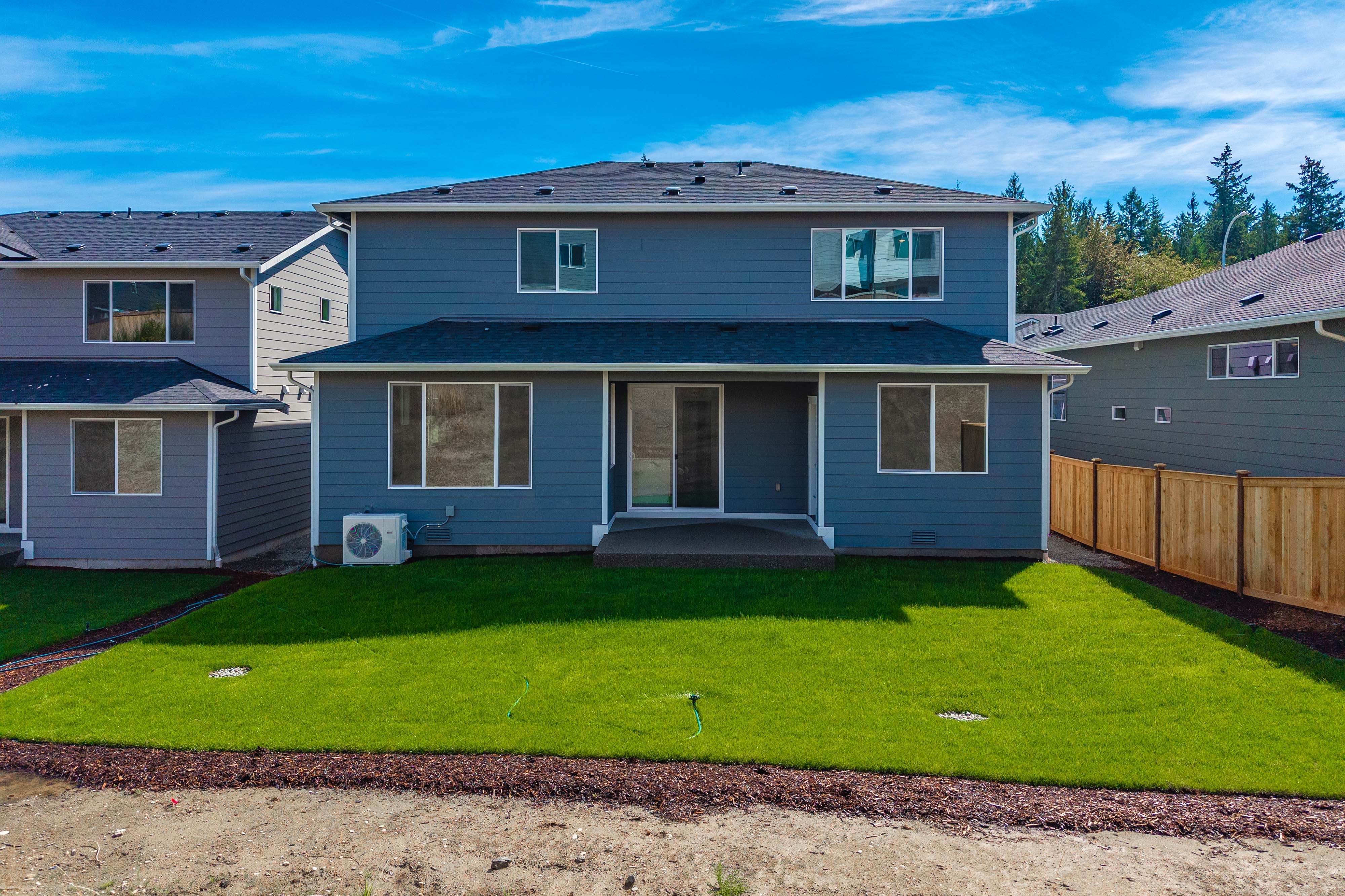 A house with a green lawn.