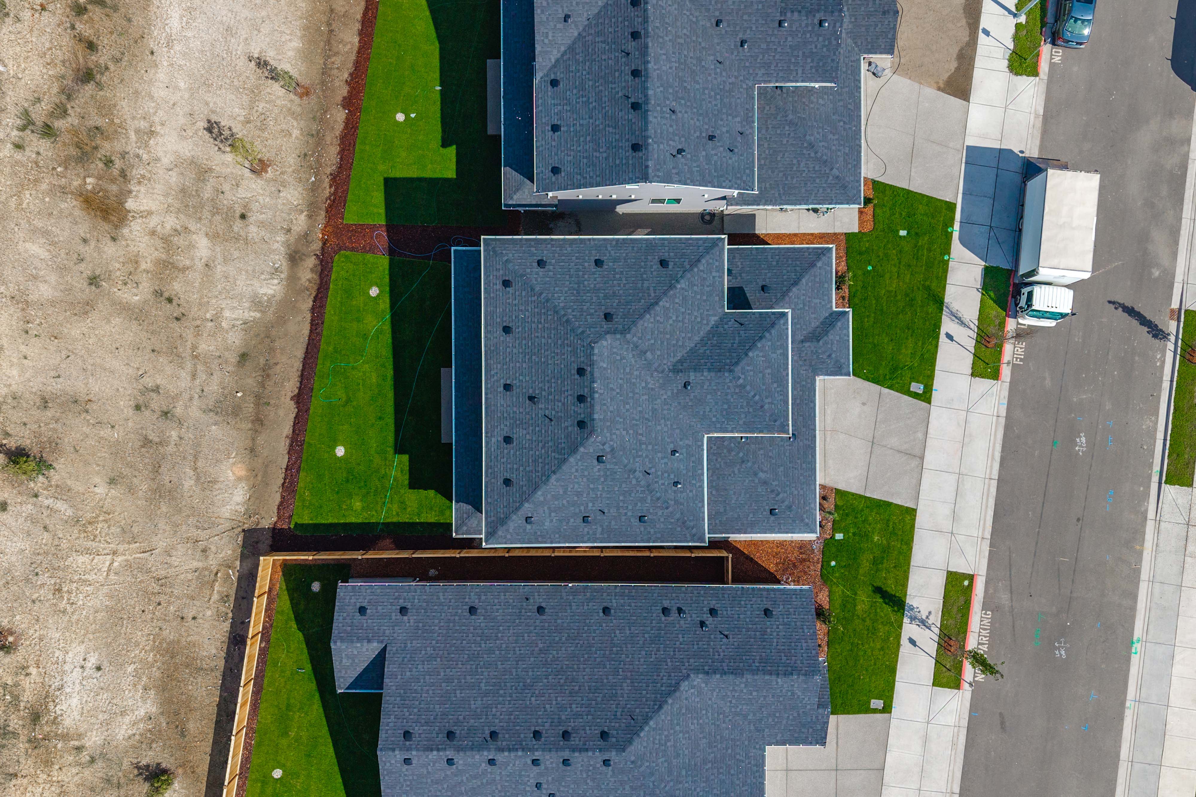 A building with a grass field.