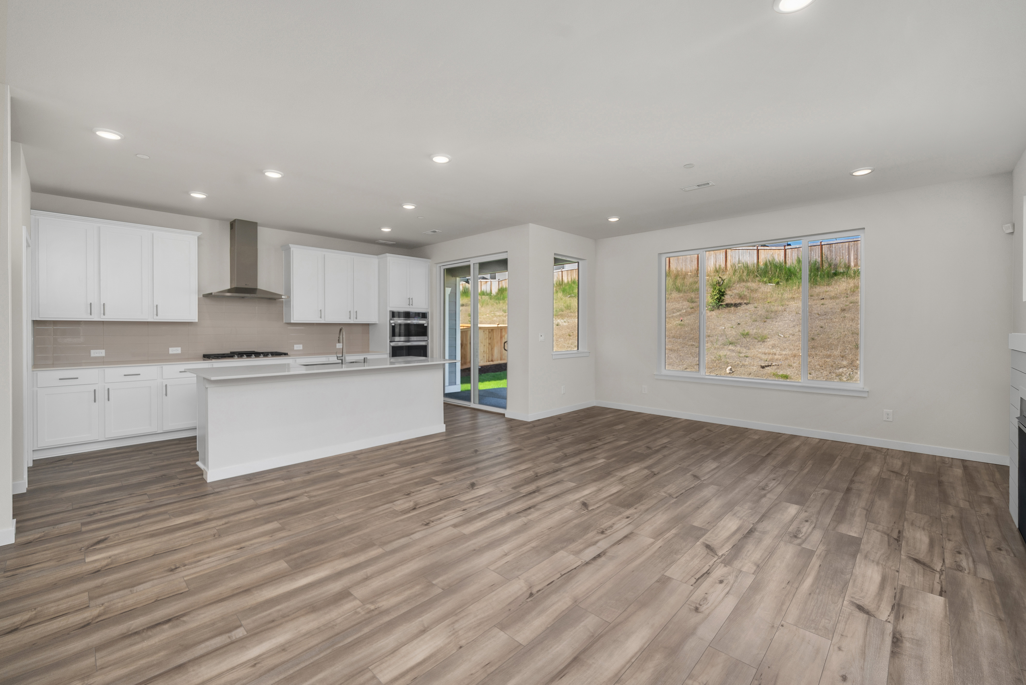 A large kitchen with white cabinets.