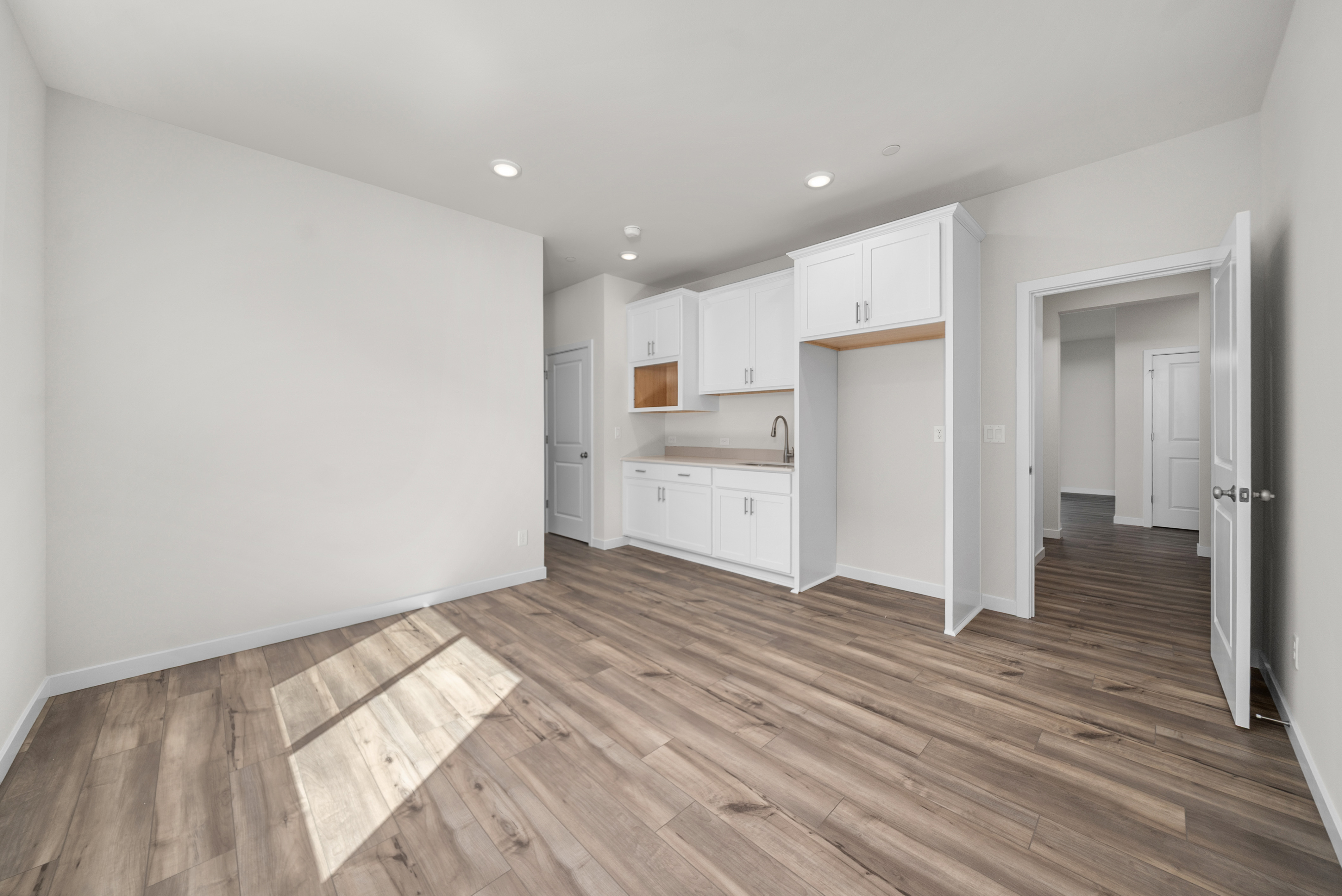 A room with white cabinets.