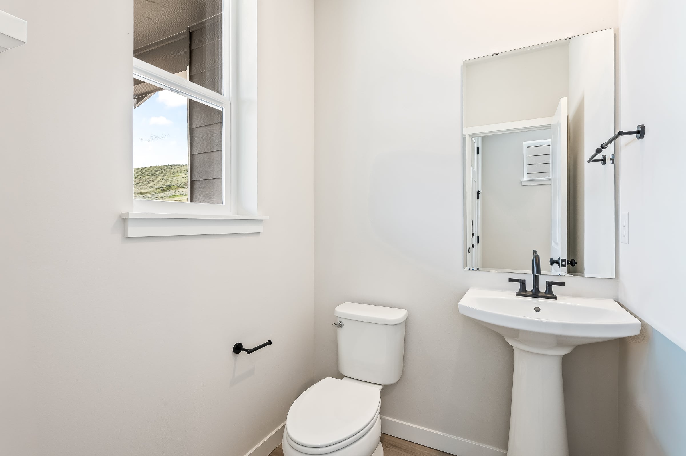 A bathroom with a toilet and sink.