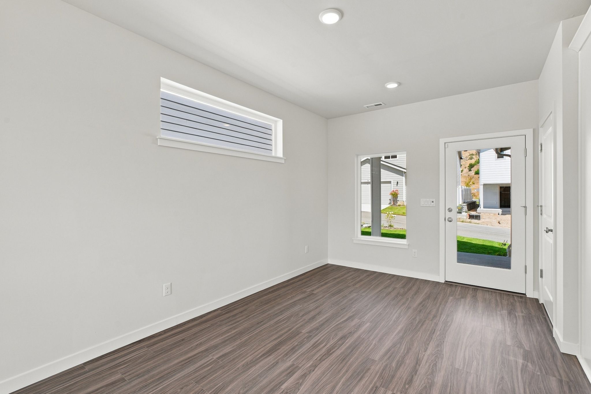 A room with a wood floor and a wood floor.