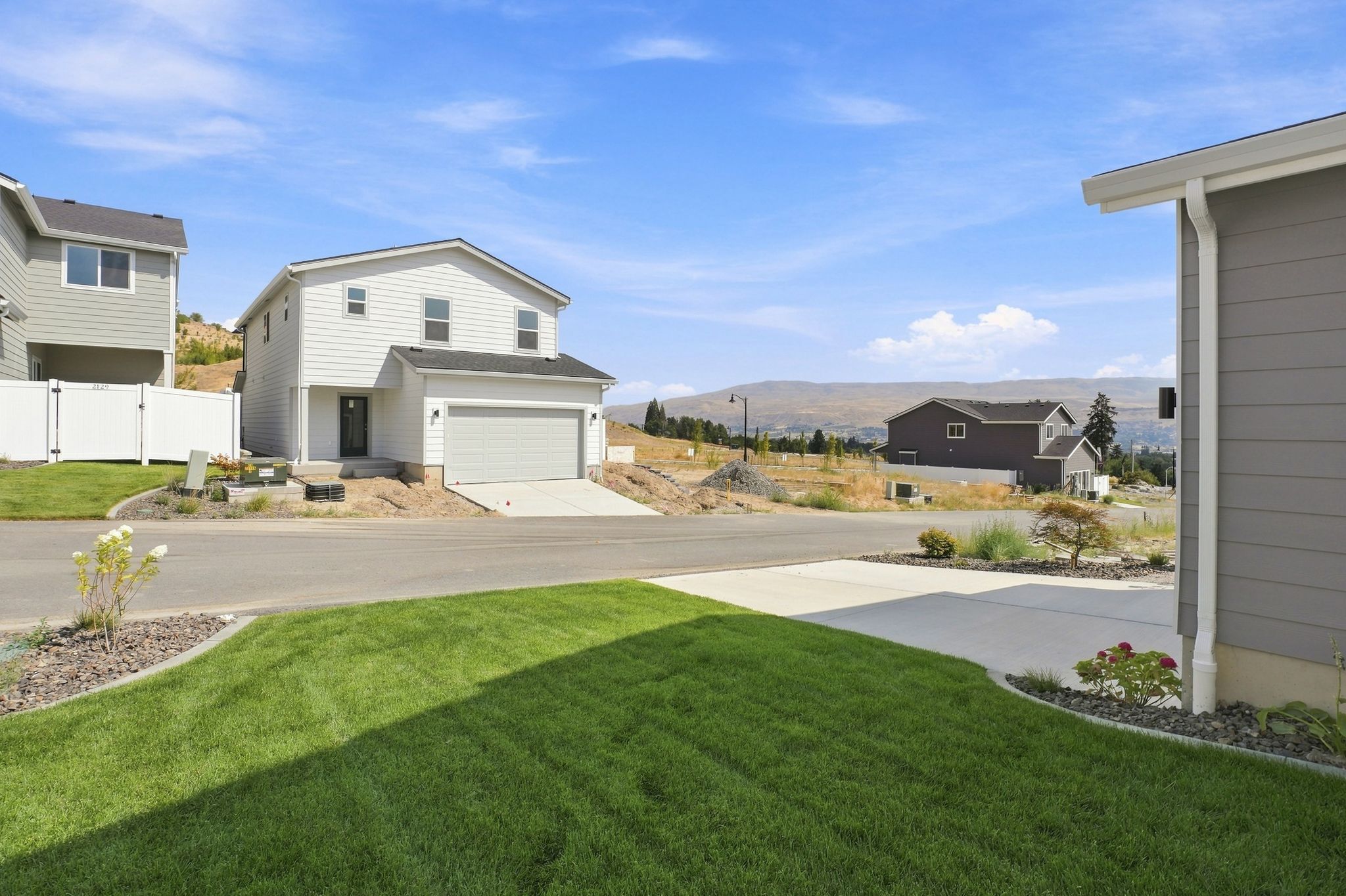 A driveway leading to a house.