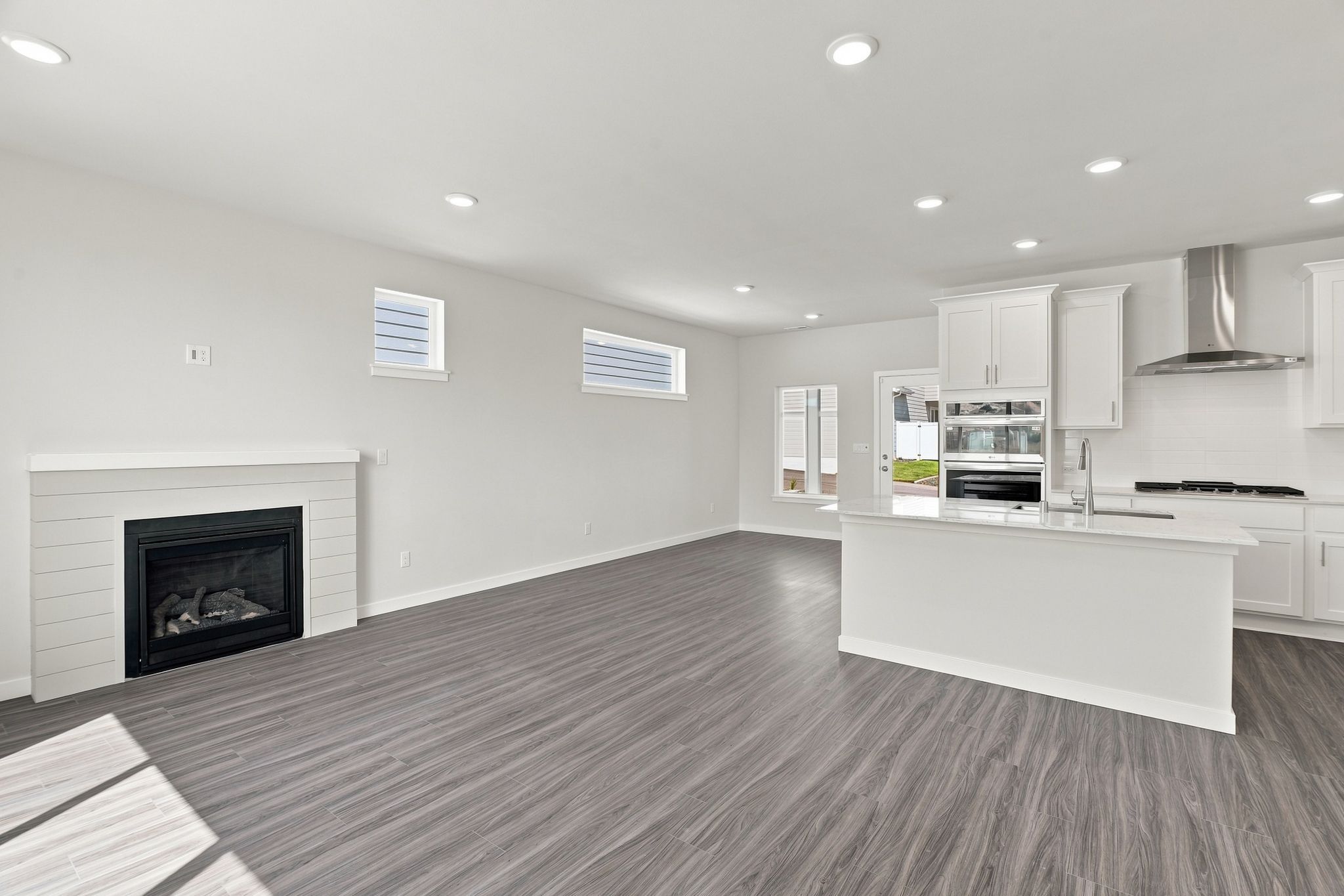 A large kitchen with a fireplace.