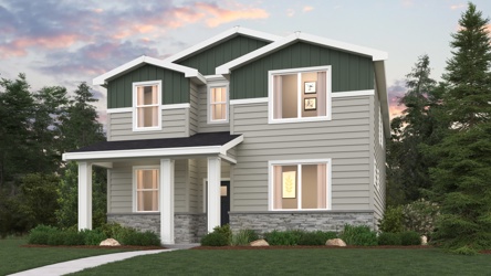 A house with a lawn in front of it.