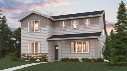 A house with a lawn in front of it.