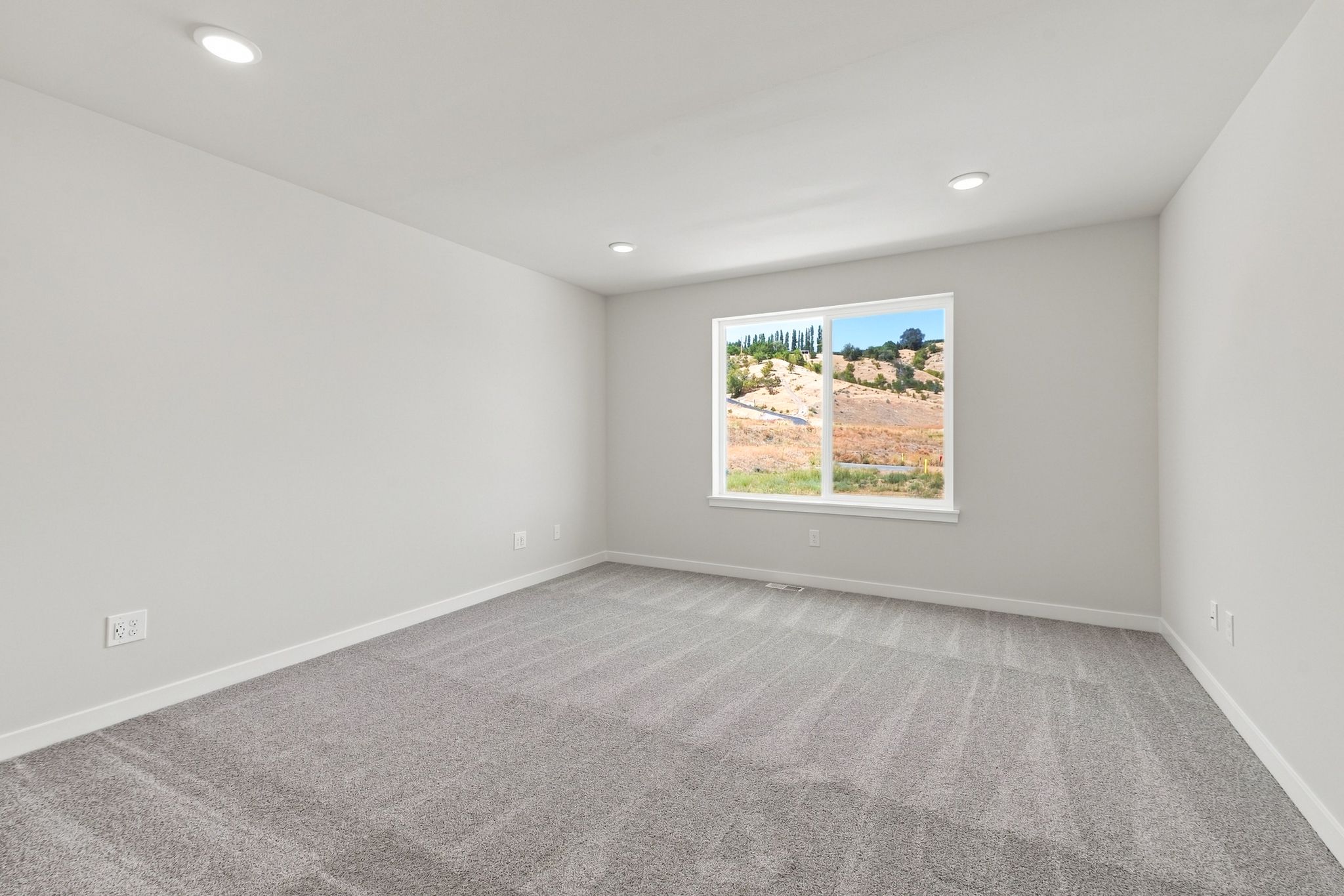 A room with a large window.