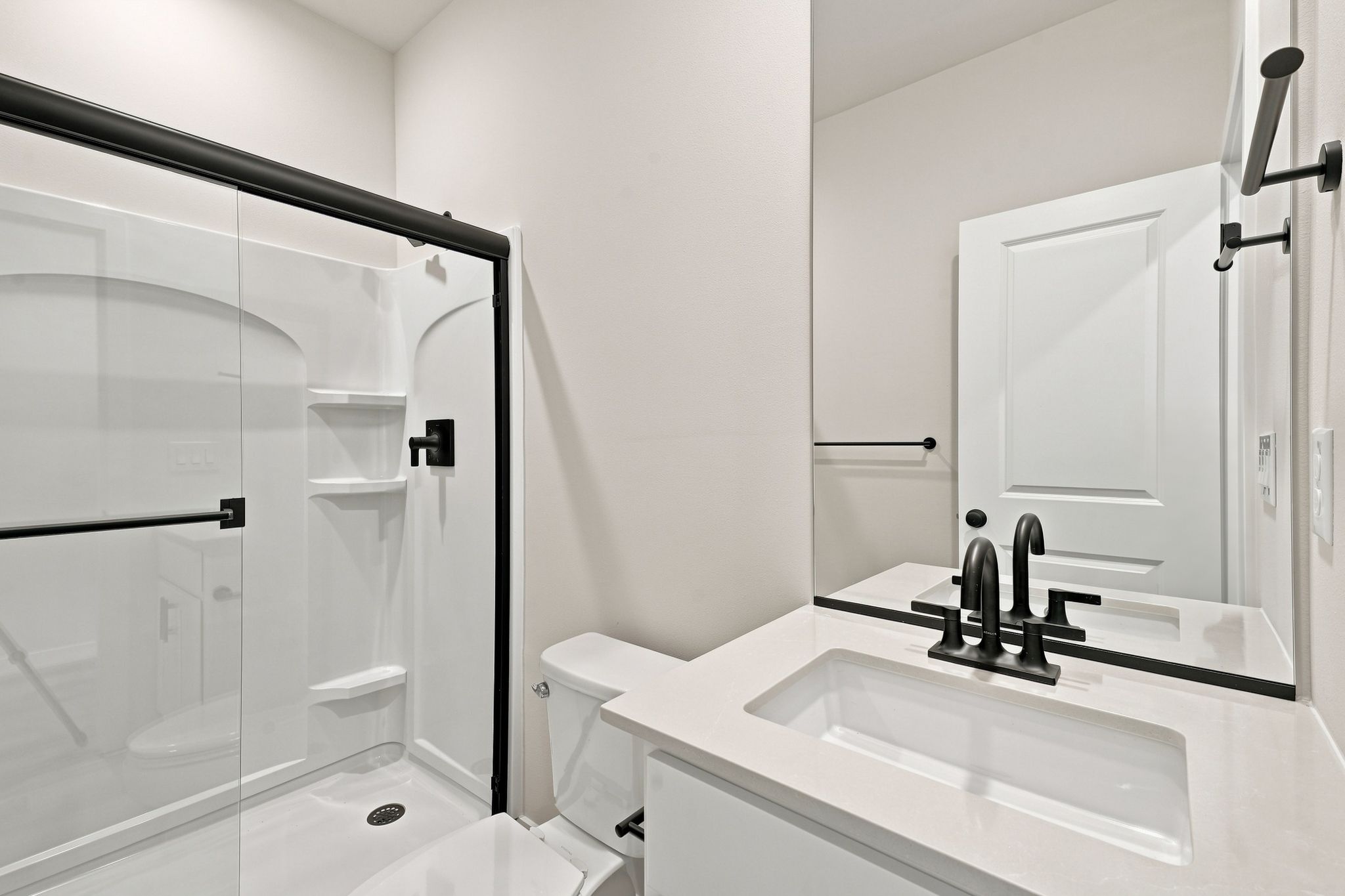 A bathroom with a glass shower.