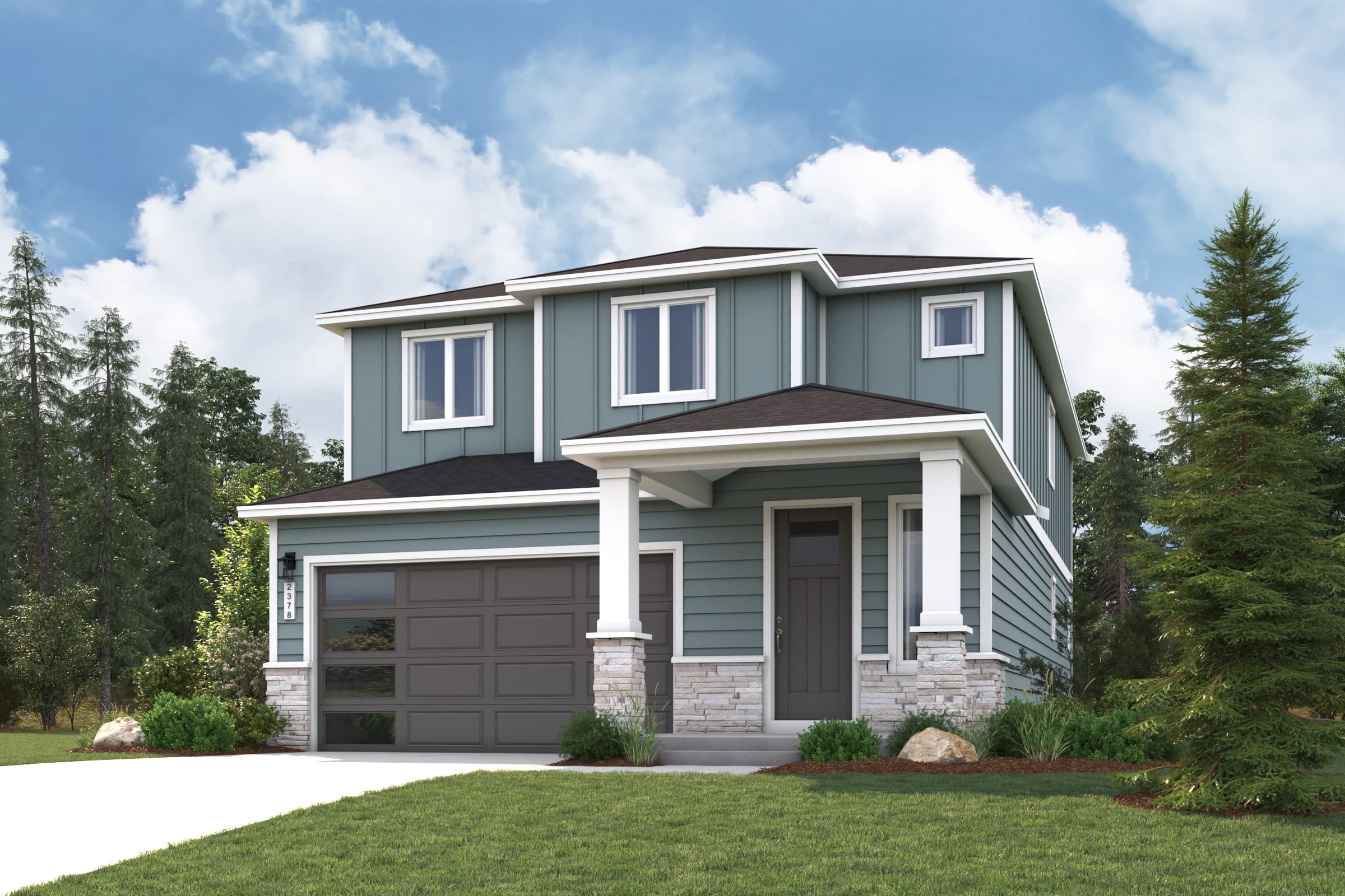 A house with a garage and trees in the back.