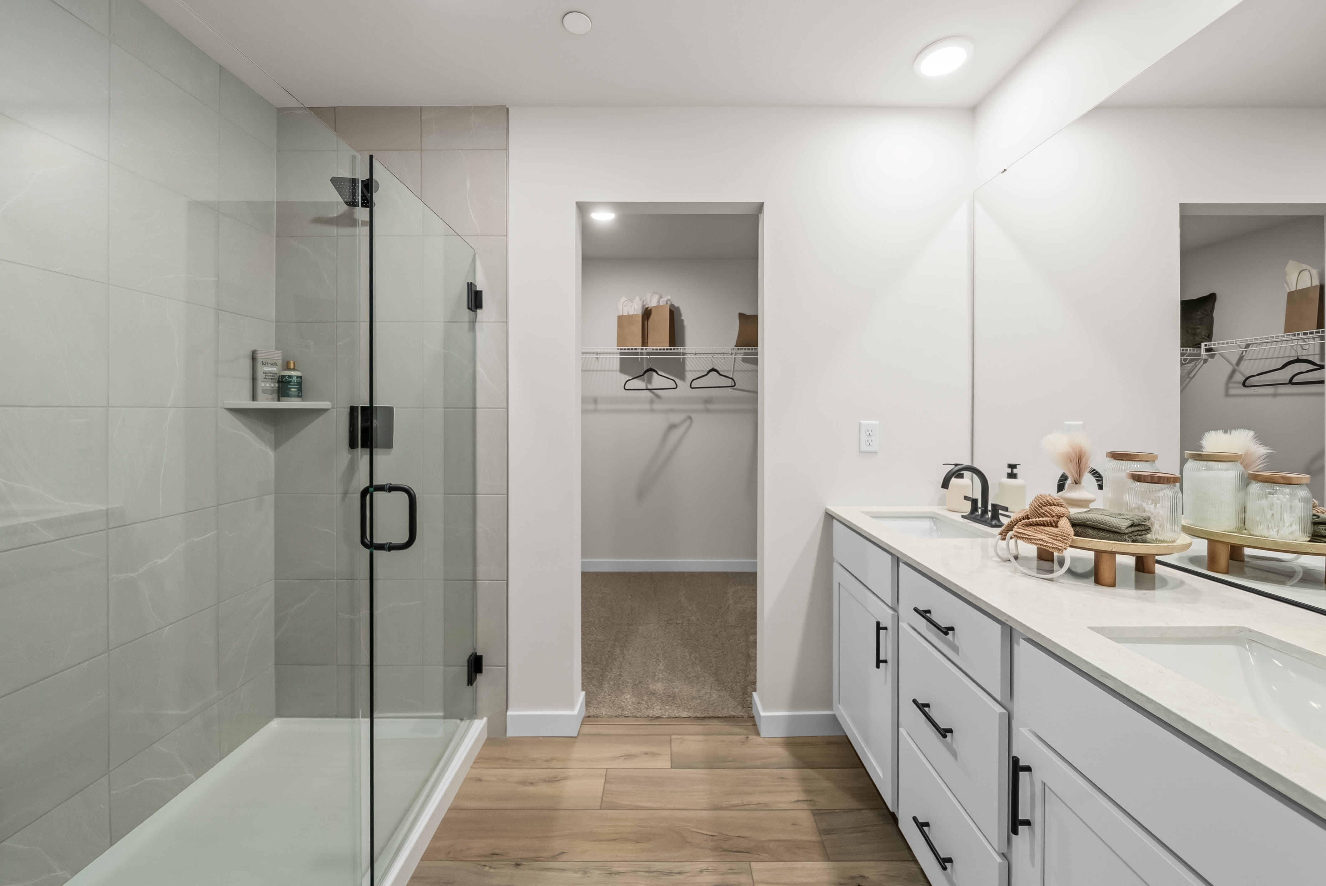 A bathroom with a shower and sink.