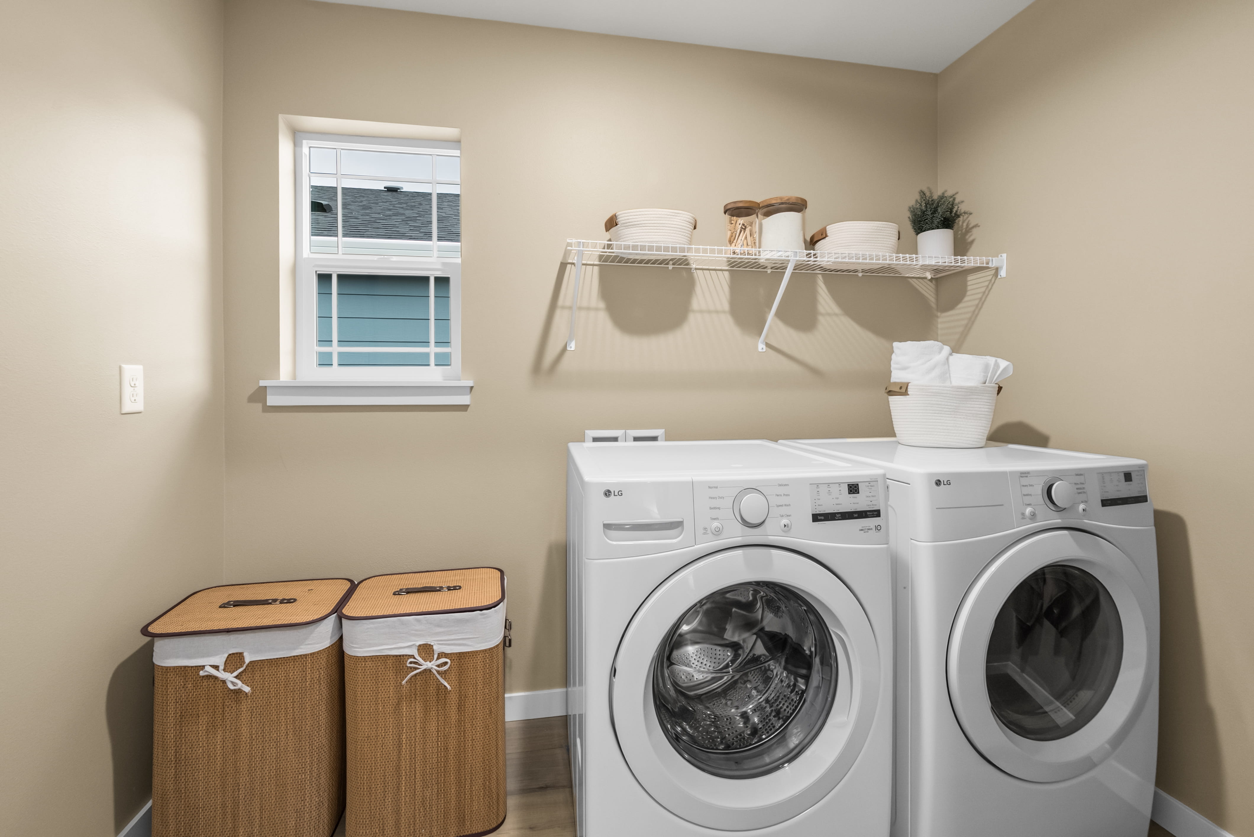 A laundry room with a washer and dryer.