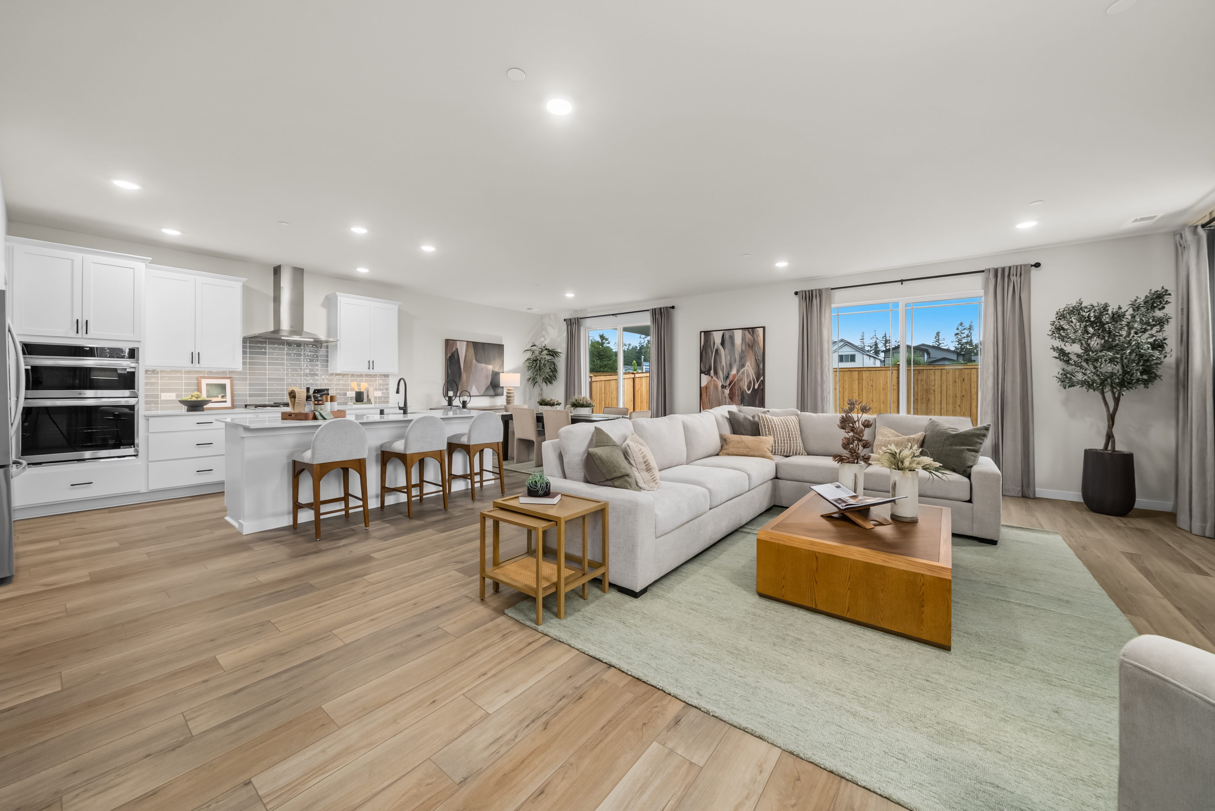 A large living room with a large kitchen and dining area.