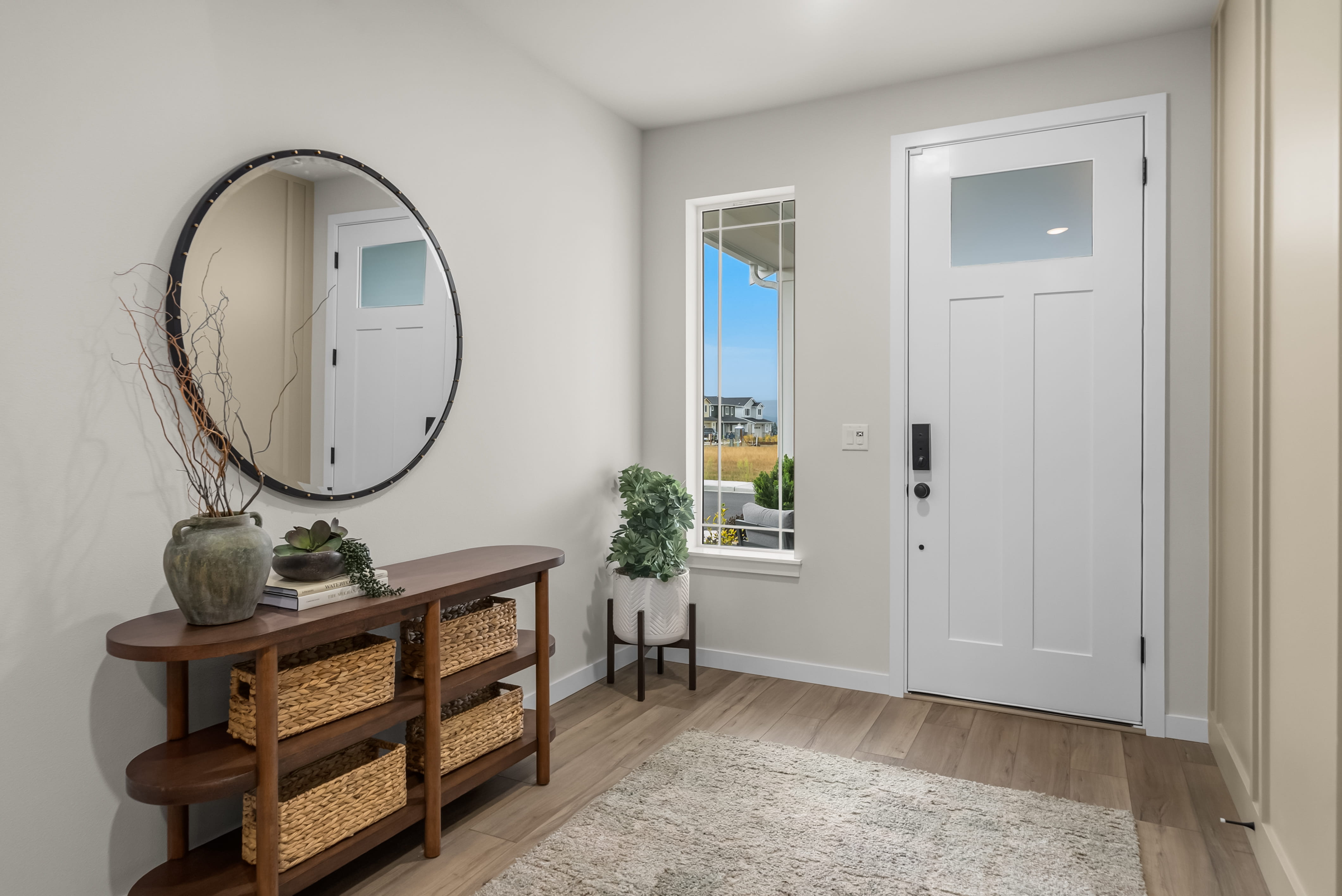 A room with a mirror and a table.