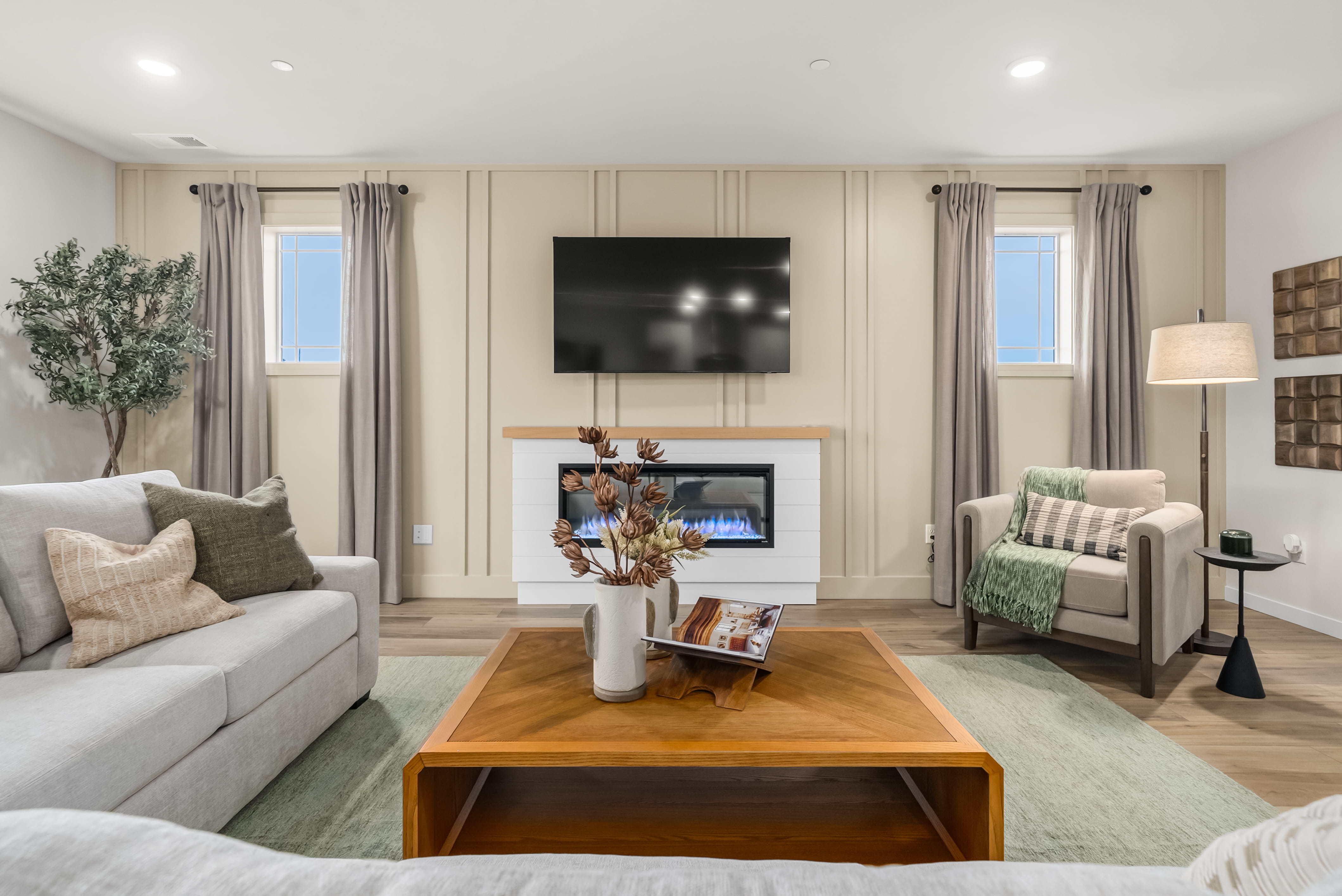 A living room with a tv and couches.