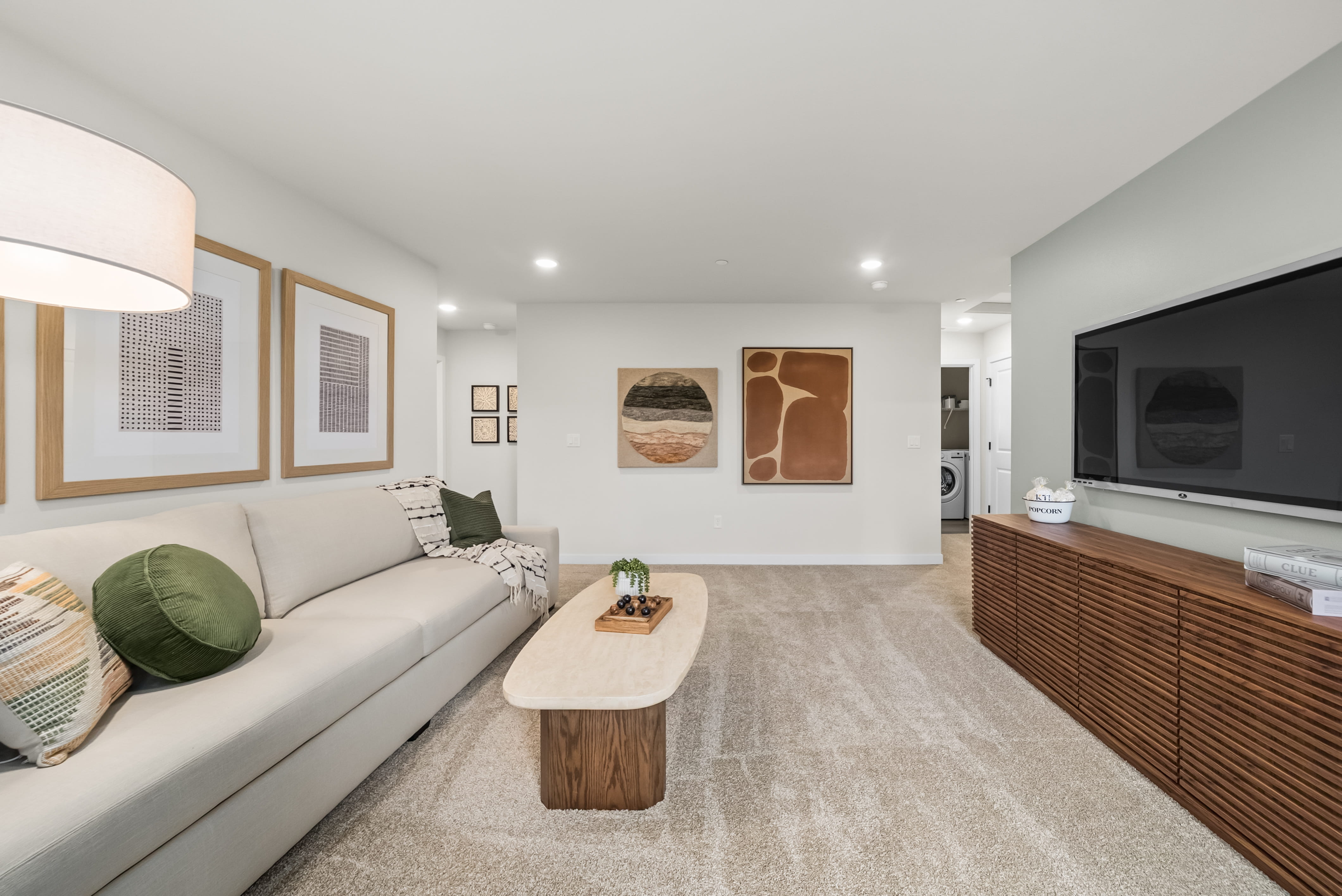 A living room with a couch and a tv.