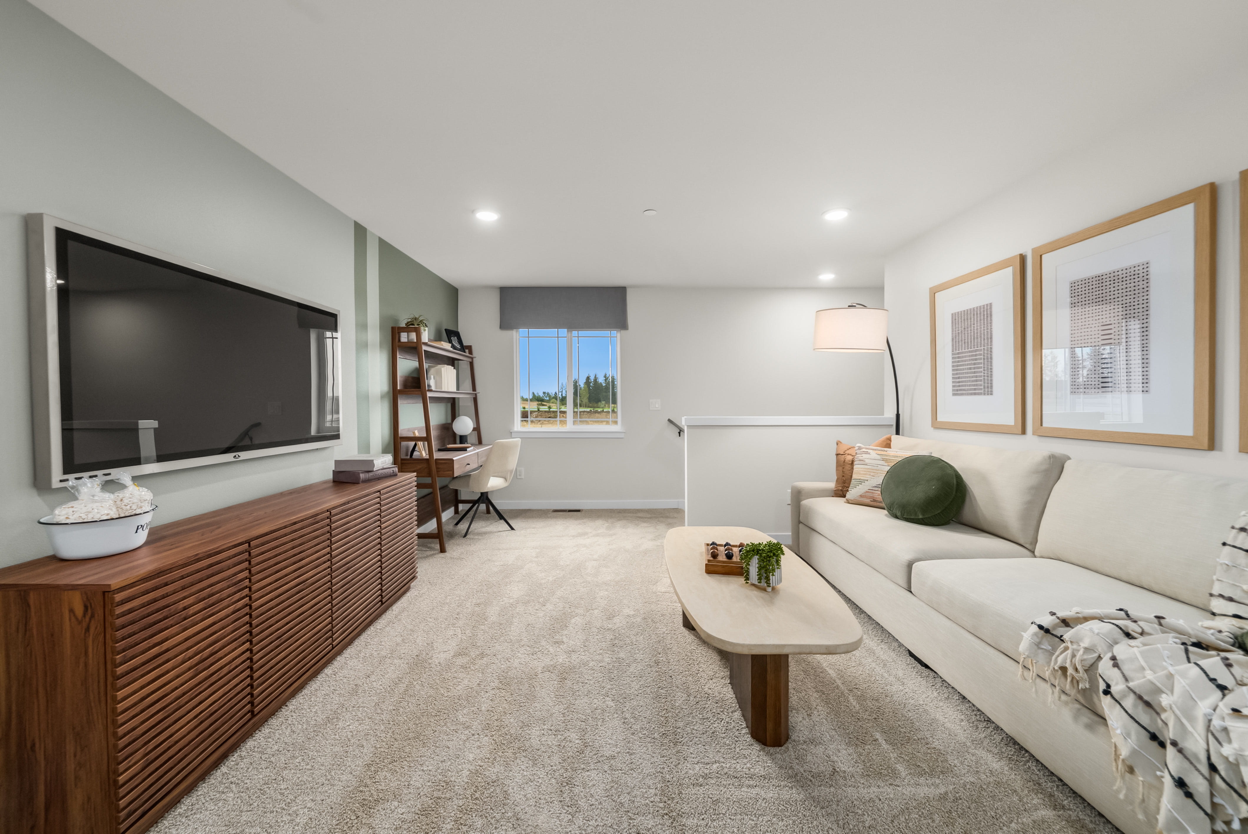 A living room with a tv and couches.