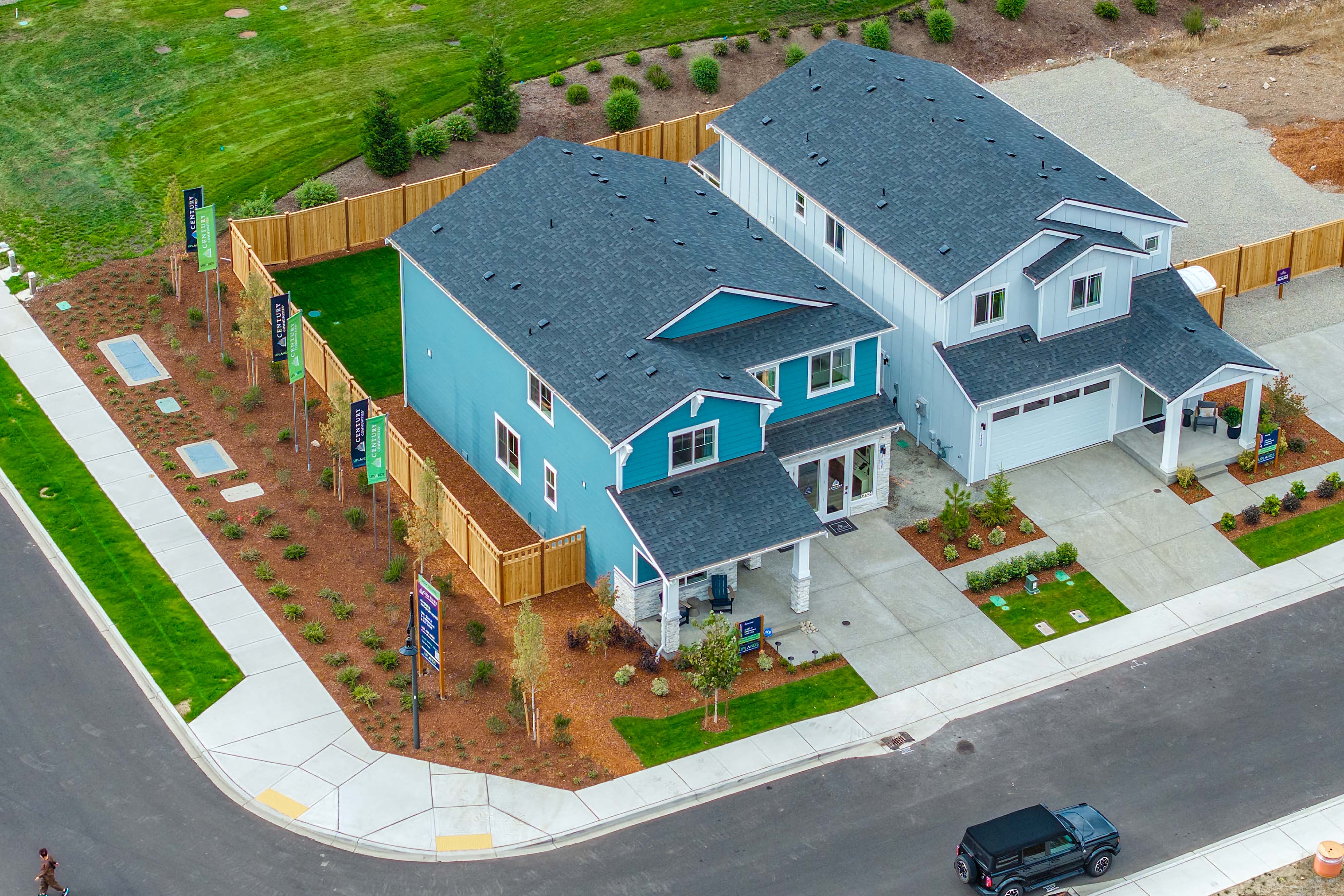 A large house with a parking lot.
