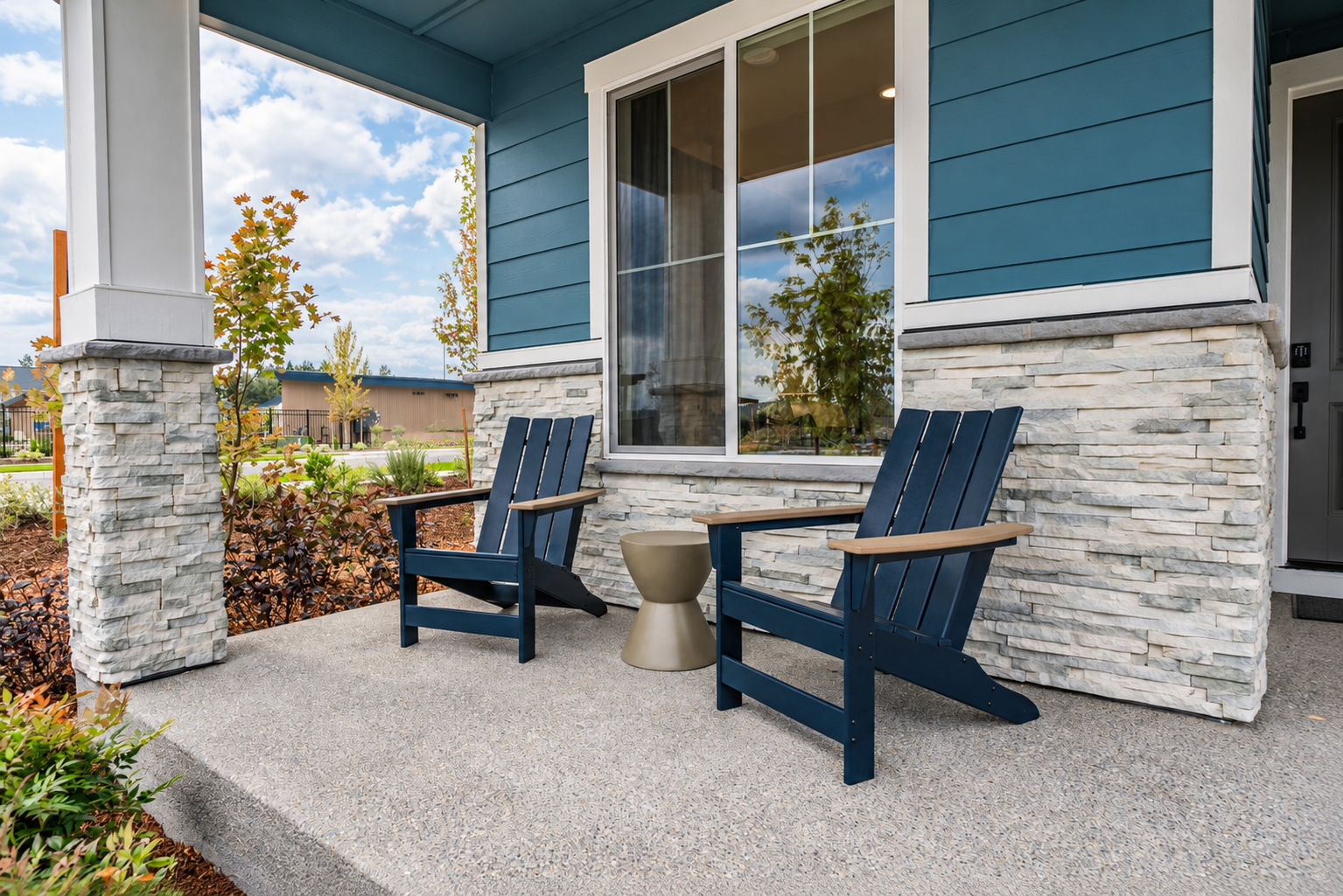 A couple of chairs outside a house.
