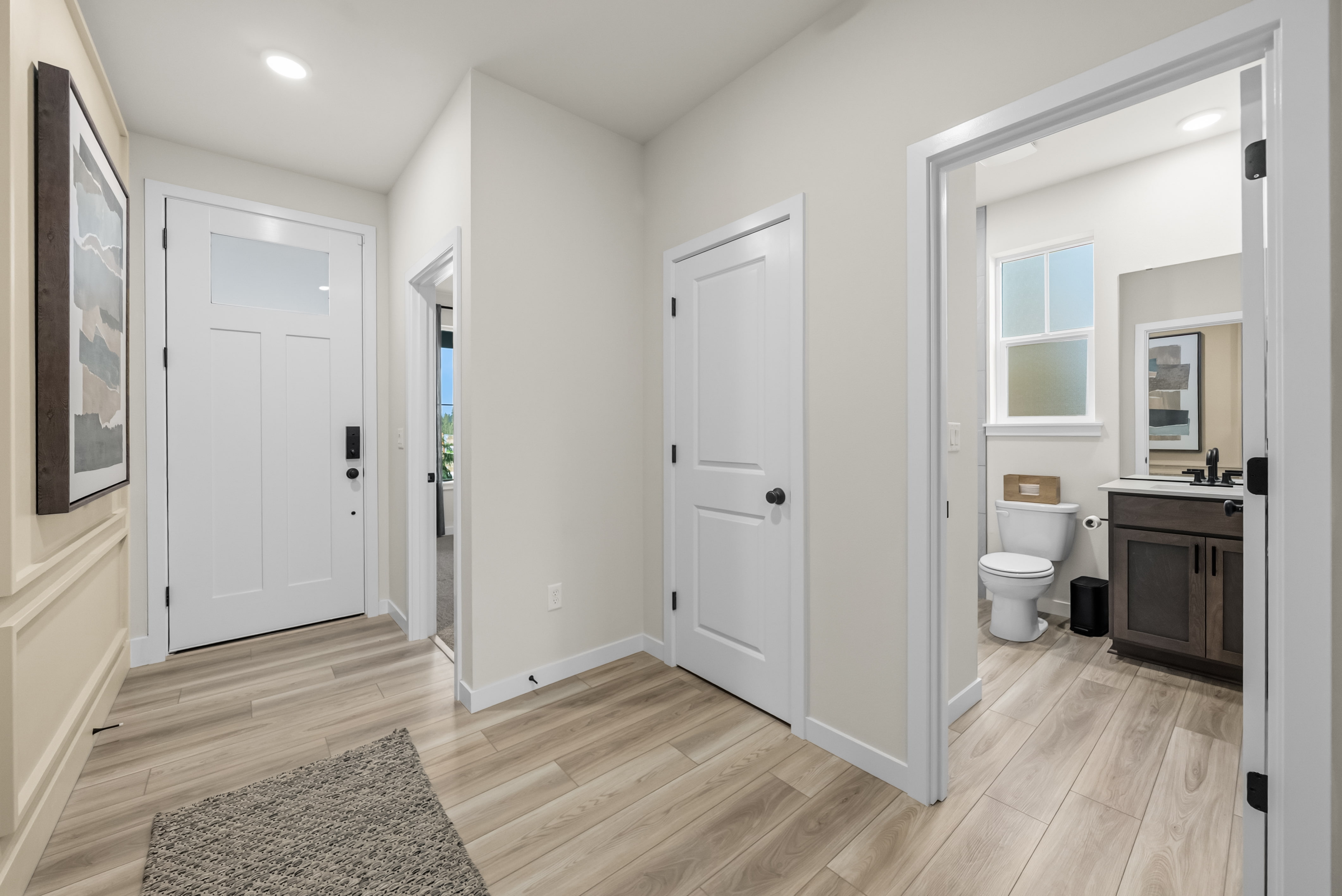 A bathroom with white doors.