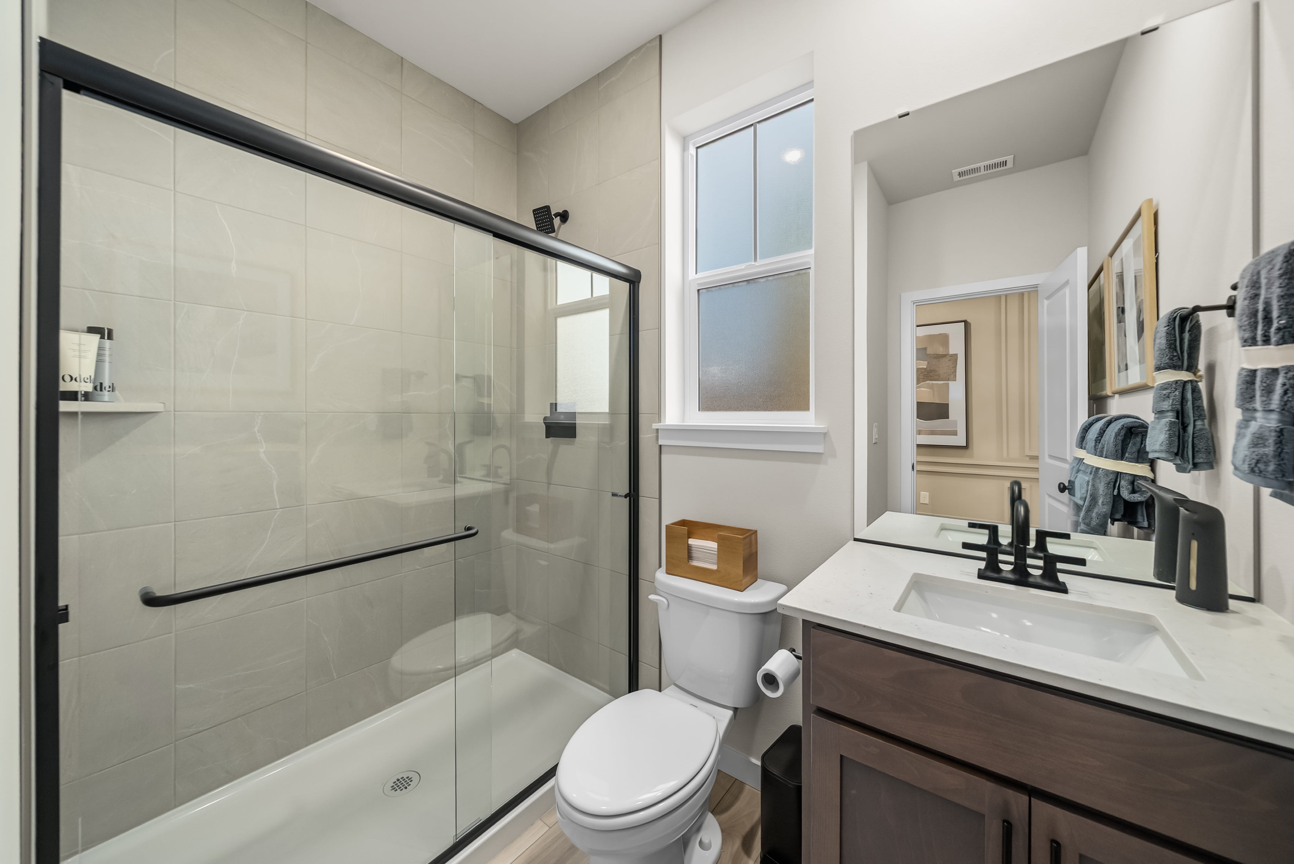 A bathroom with a glass shower.