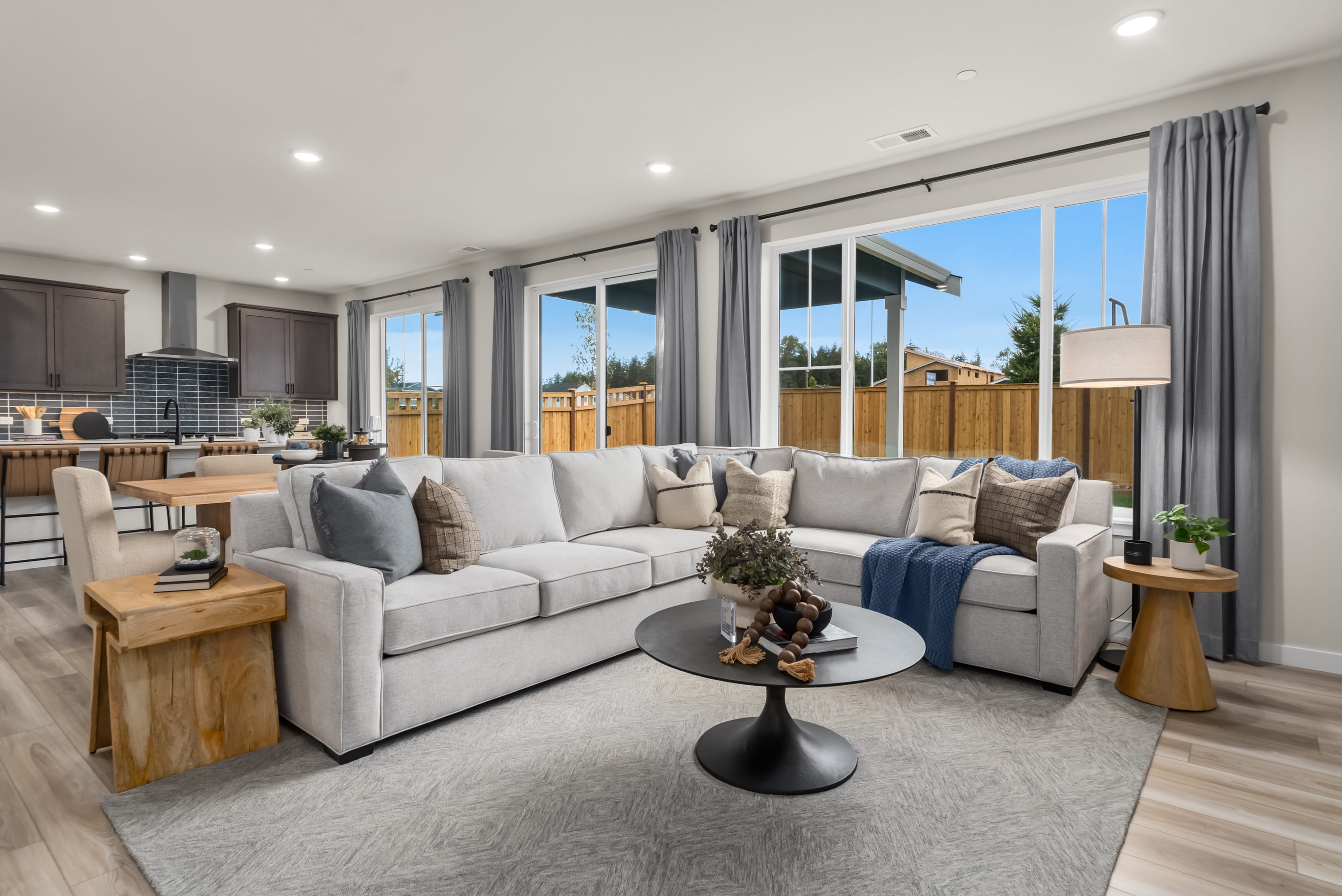 A large living room with a large window.