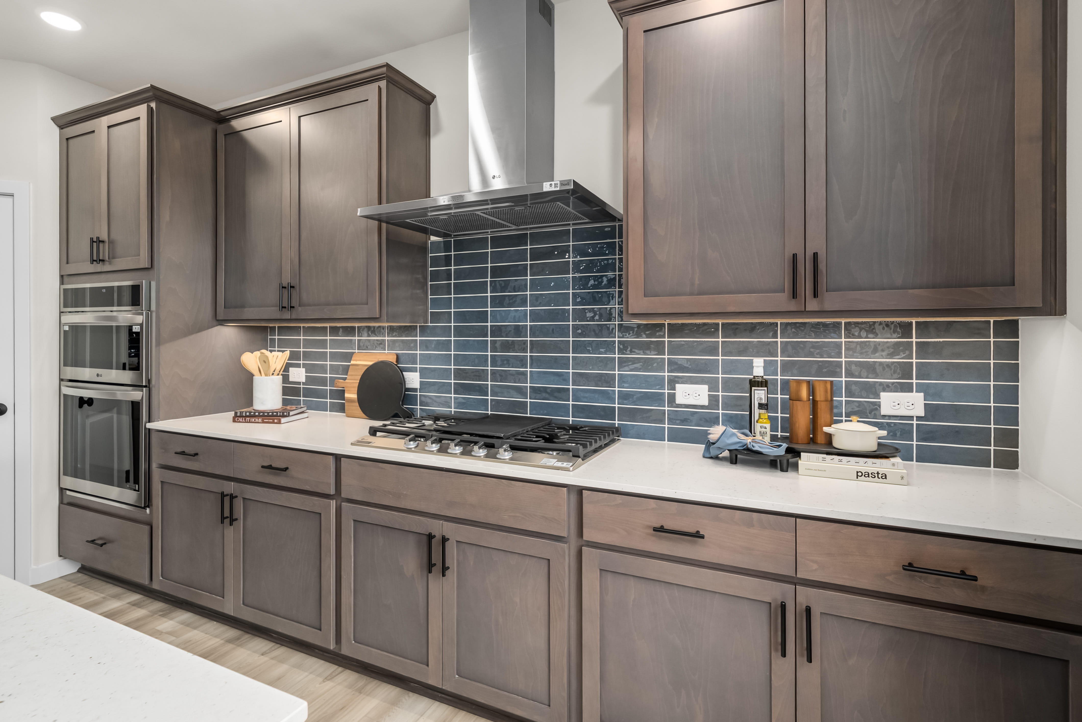 A kitchen with wooden cabinets.