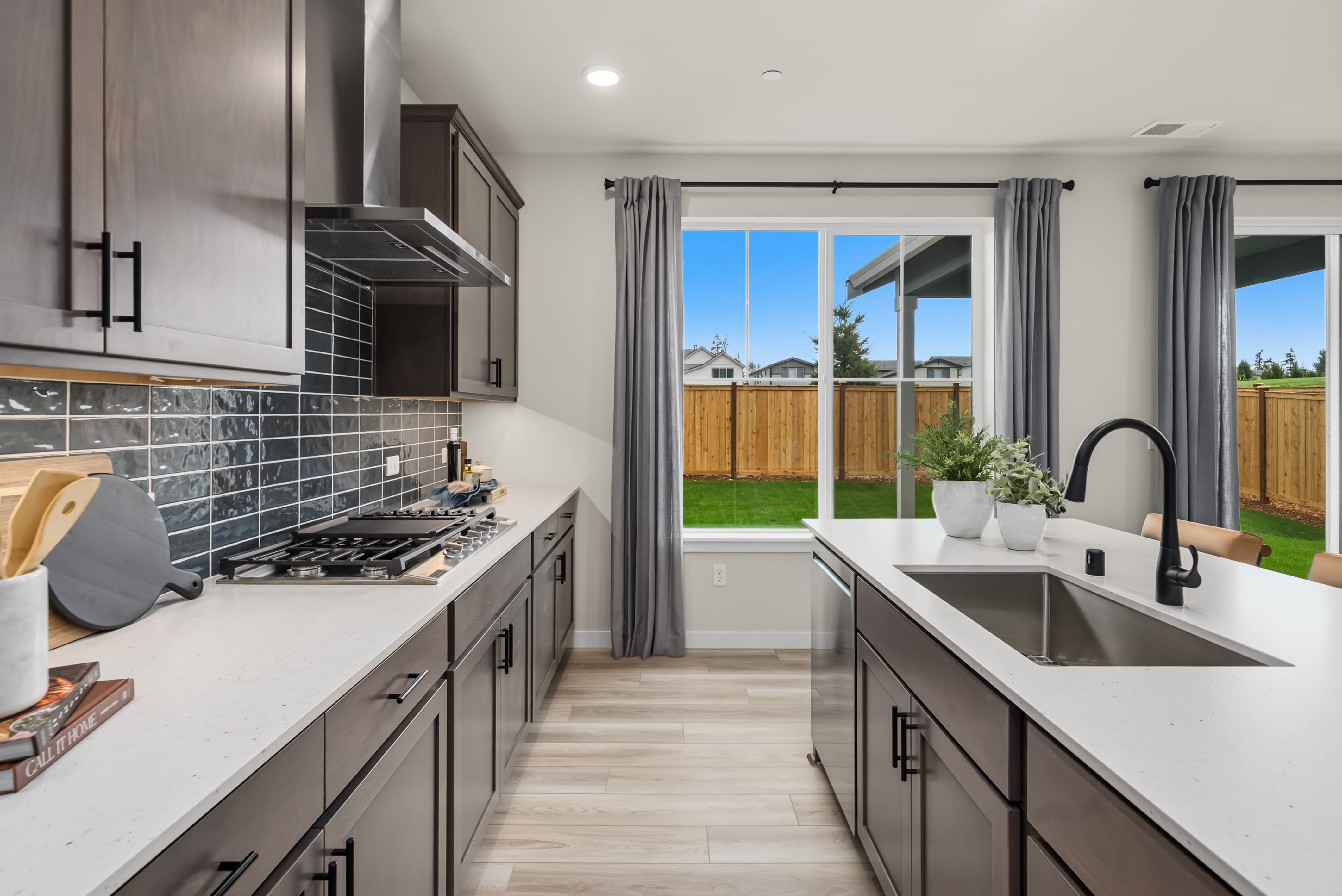 A kitchen with a large window.