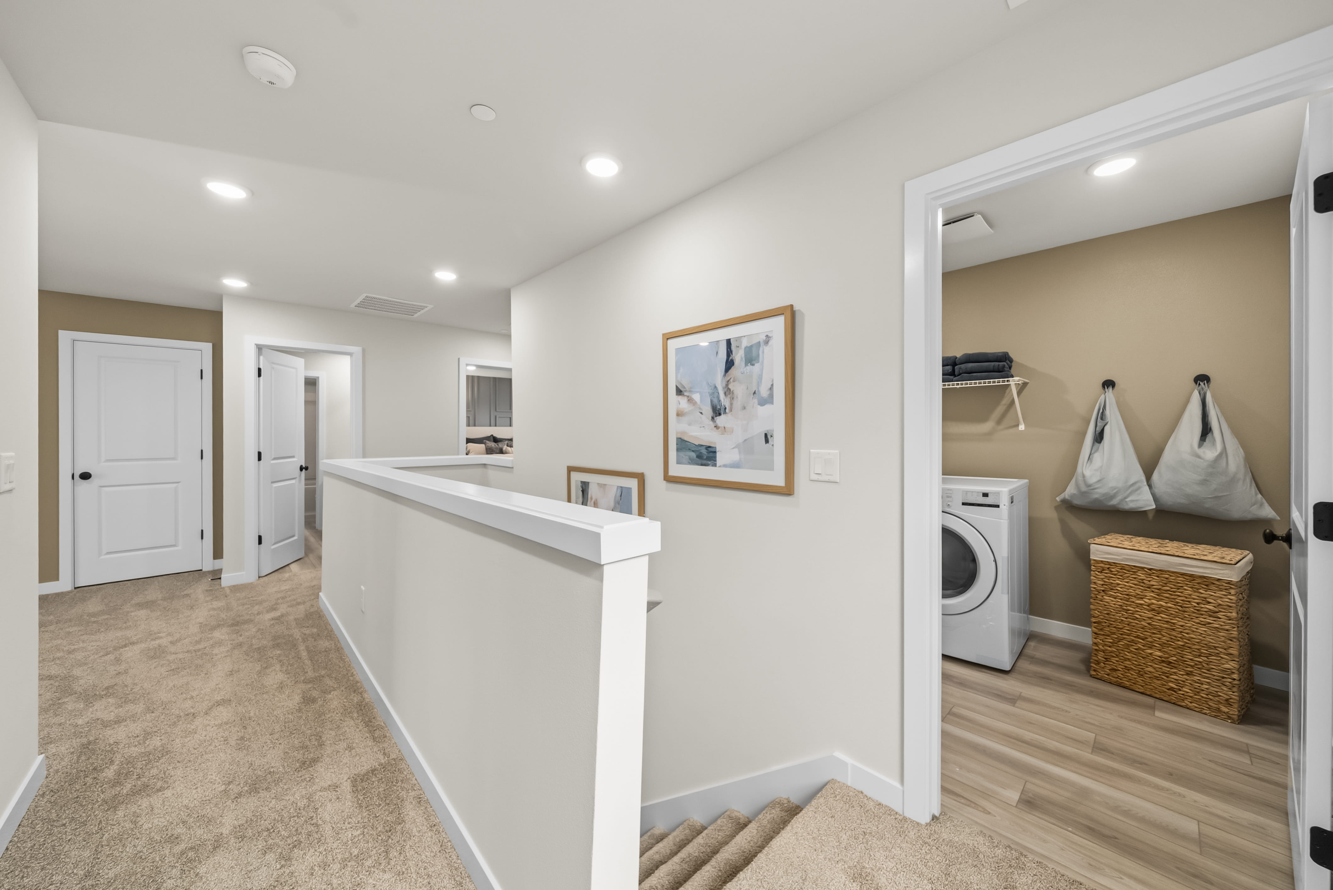 A bathroom with a washer and dryer.