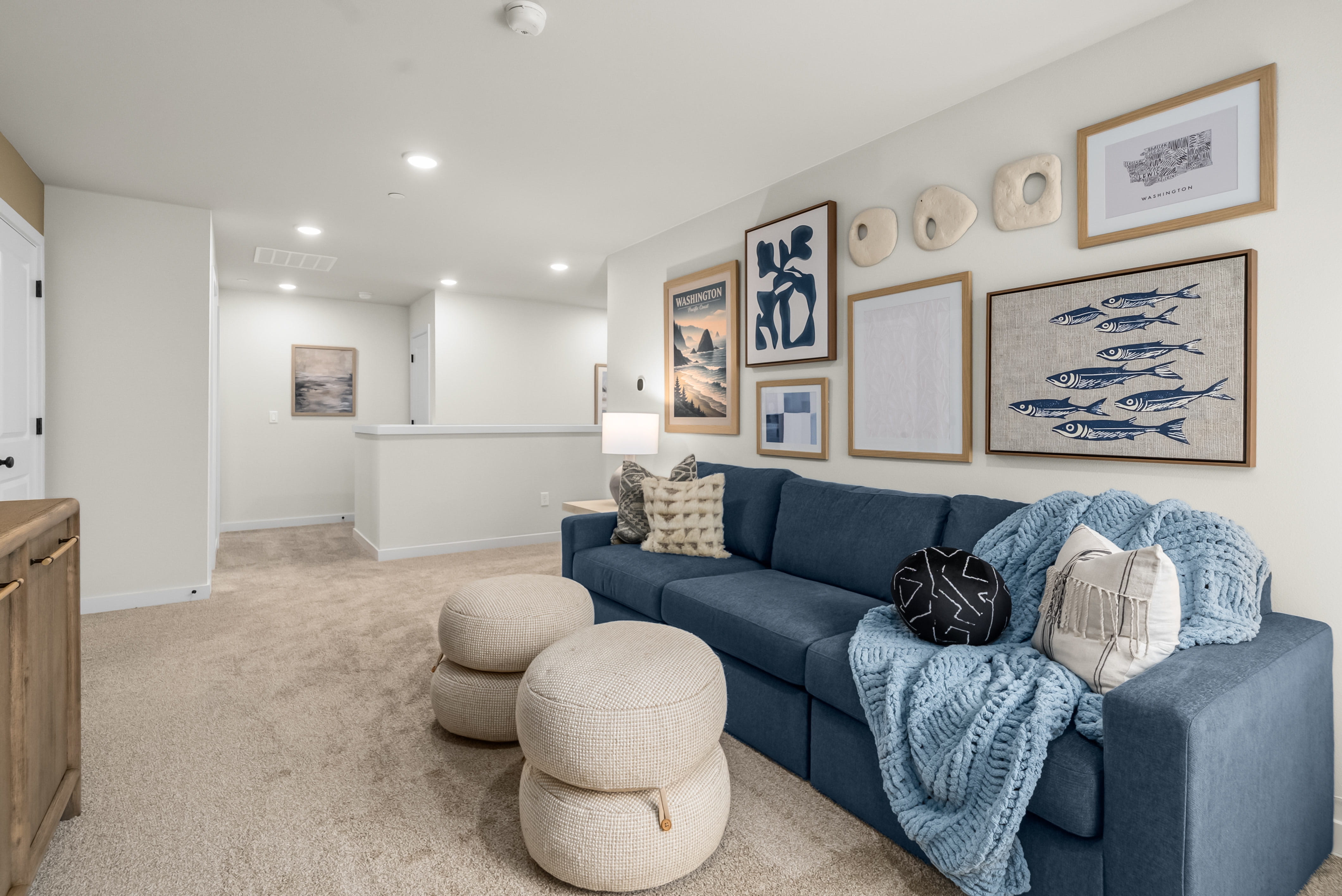 A living room with a couch and a table.