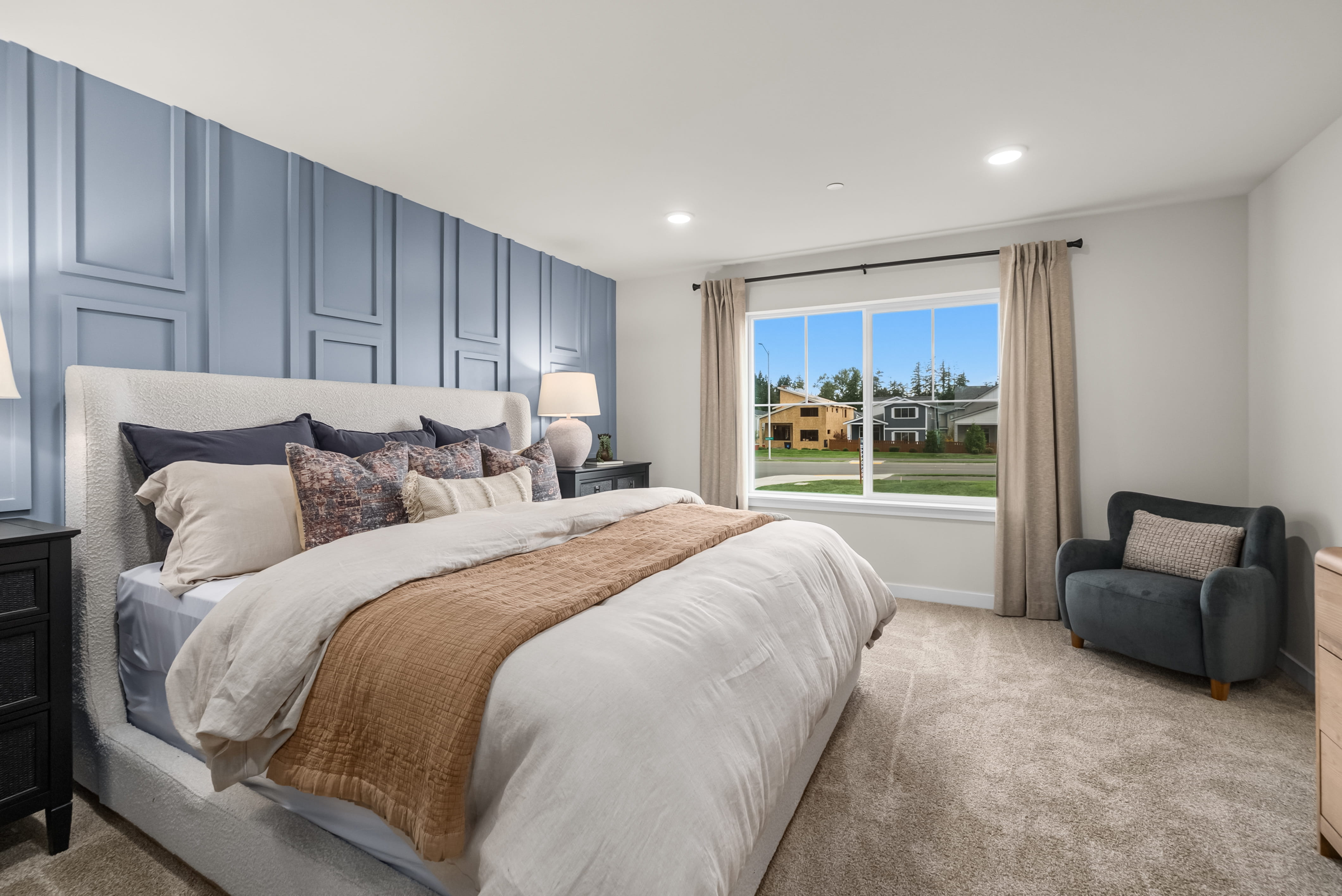 A bedroom with a large bed.