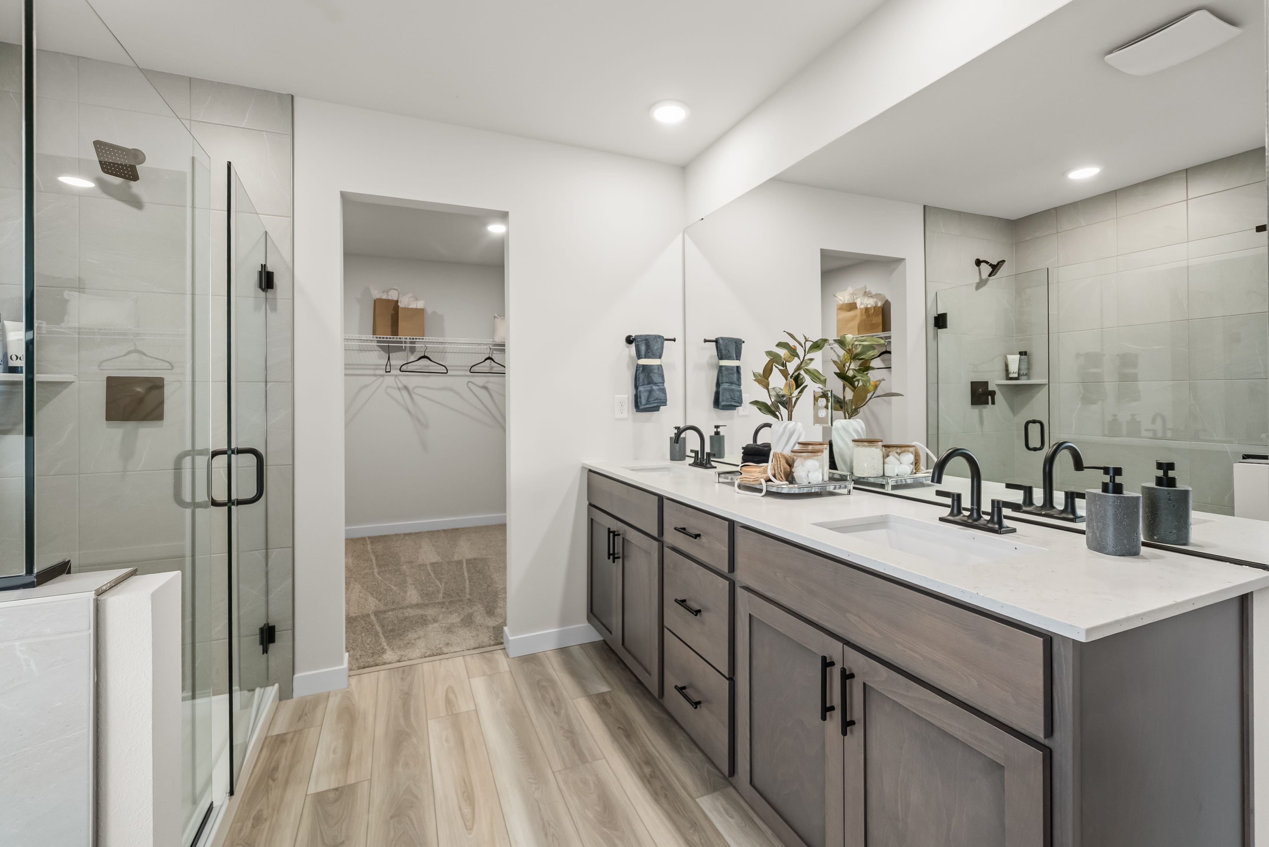 A bathroom with a large mirror.