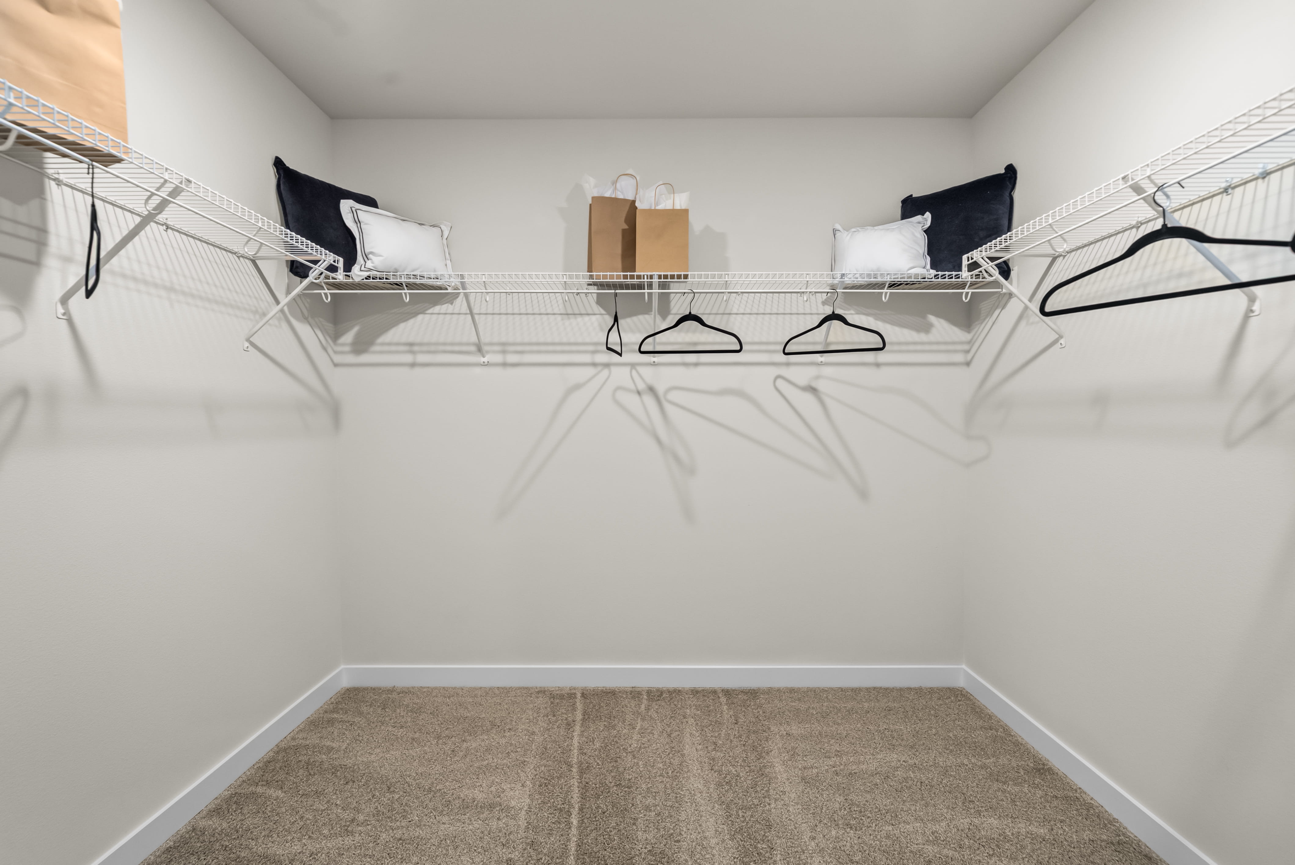 A room with a bed and a chair.