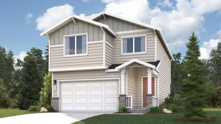 A house with a garage and trees.