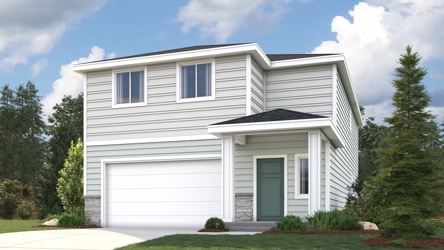 A white house with a garage.