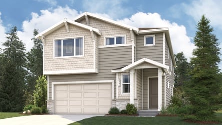 A house with a garage and trees around it.