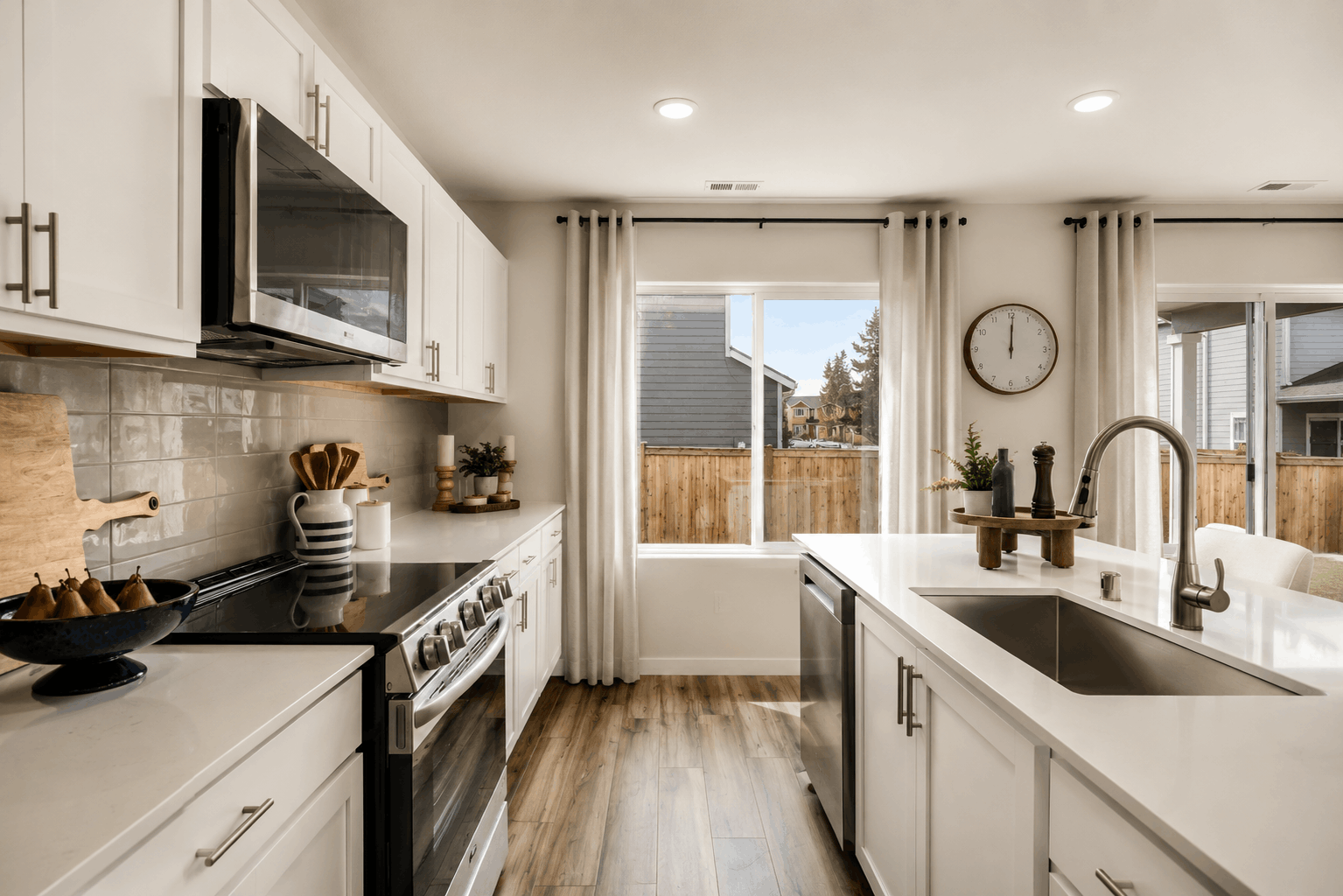 A kitchen with a large window.