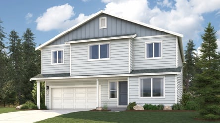 A white house with a driveway.